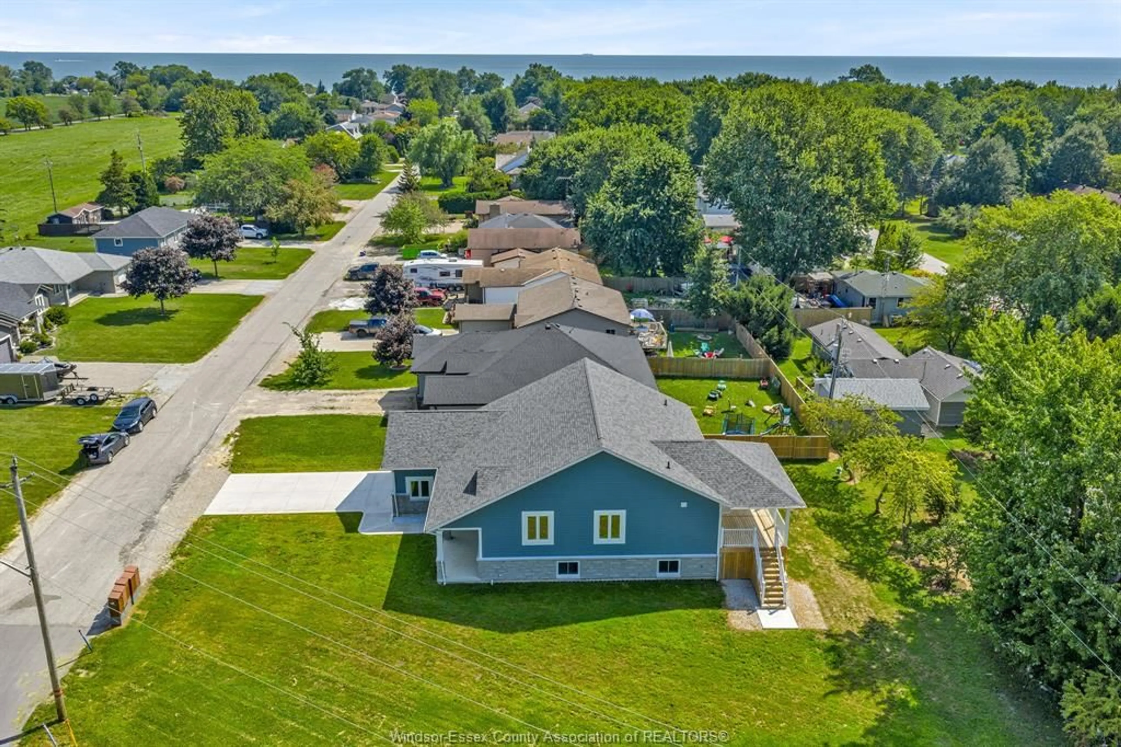 A pic from outside/outdoor area/front of a property/back of a property/a pic from drone, water/lake/river/ocean view for 157 GLOUCESTER Dr, Essex Ontario N0R 1G0