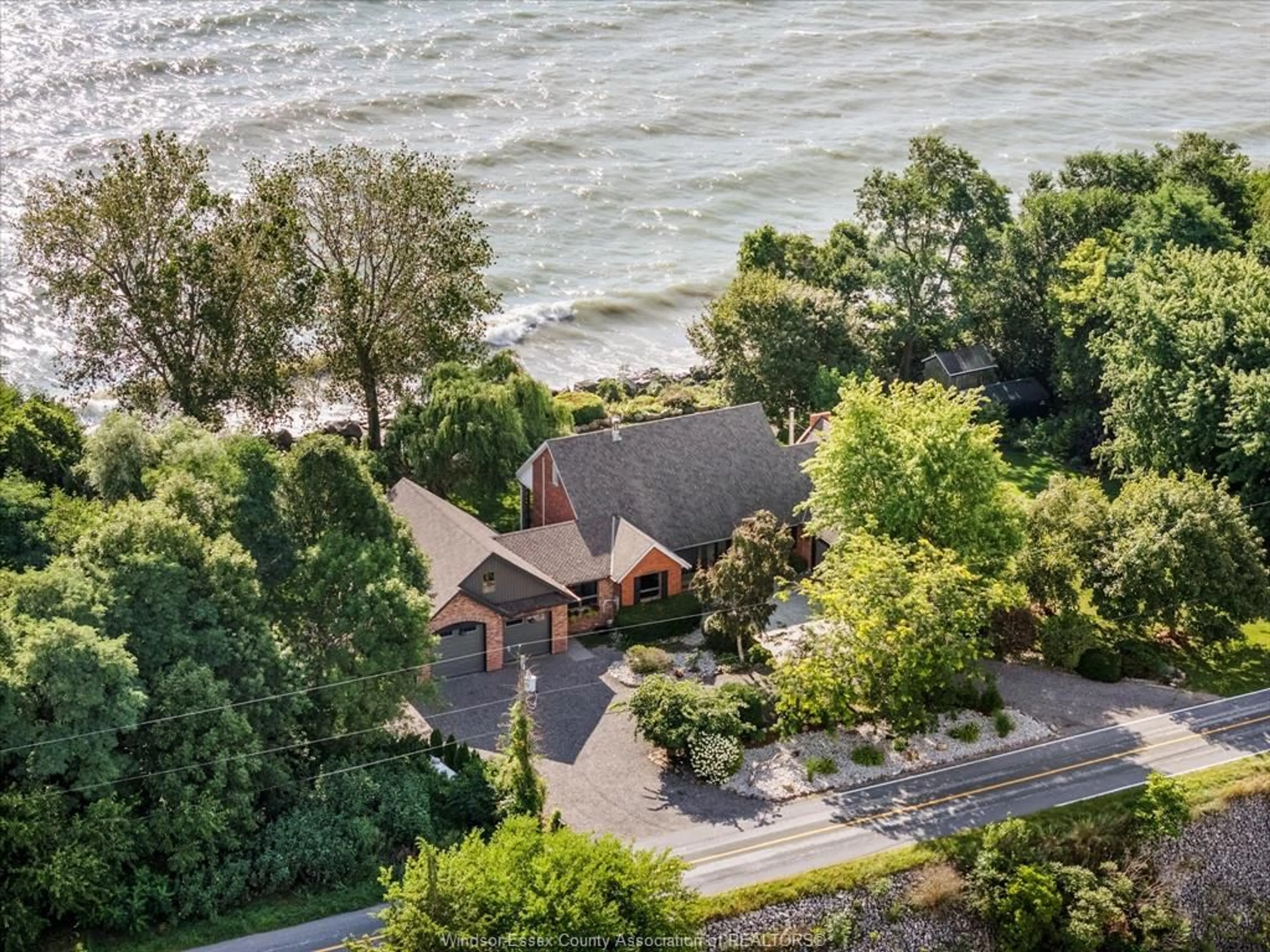A pic from outside/outdoor area/front of a property/back of a property/a pic from drone, water/lake/river/ocean view for 266 EAST BEACH RD, Leamington Ontario N8H 3V7