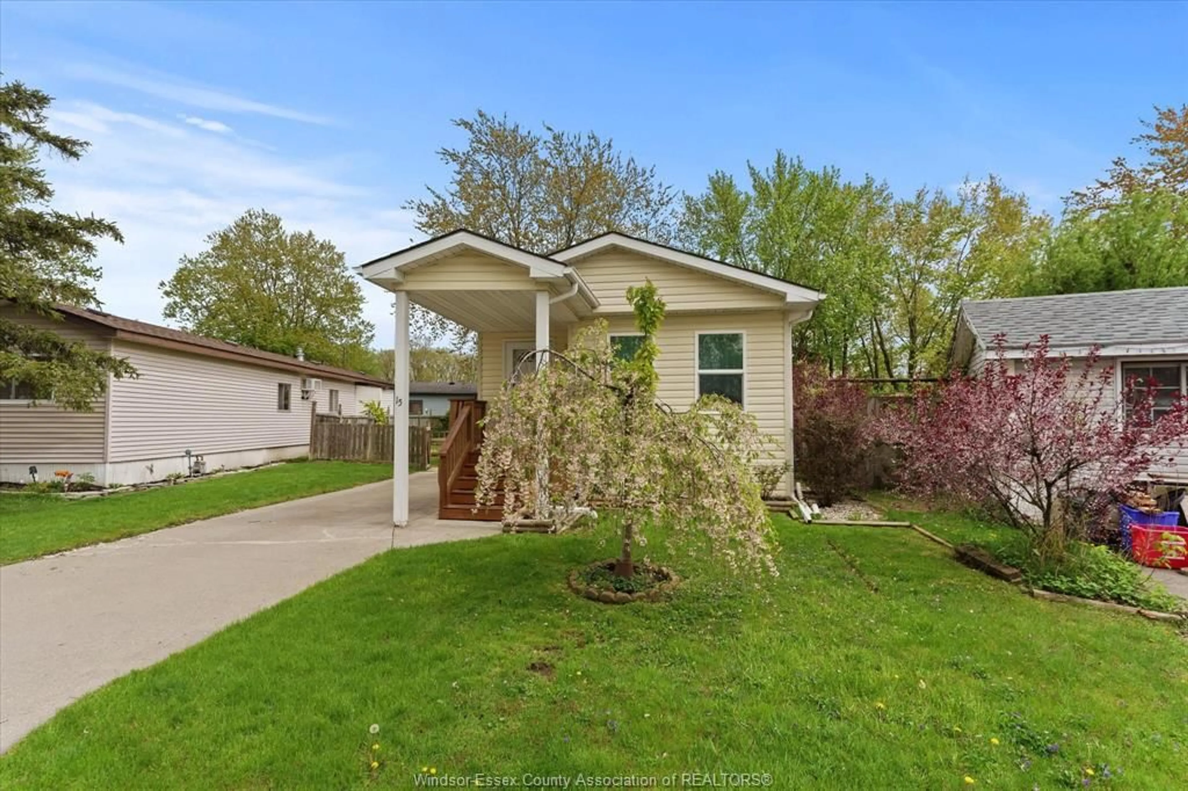 Home with vinyl exterior material, street for 15 SPRUCE St, McGregor Ontario N0R 1J0