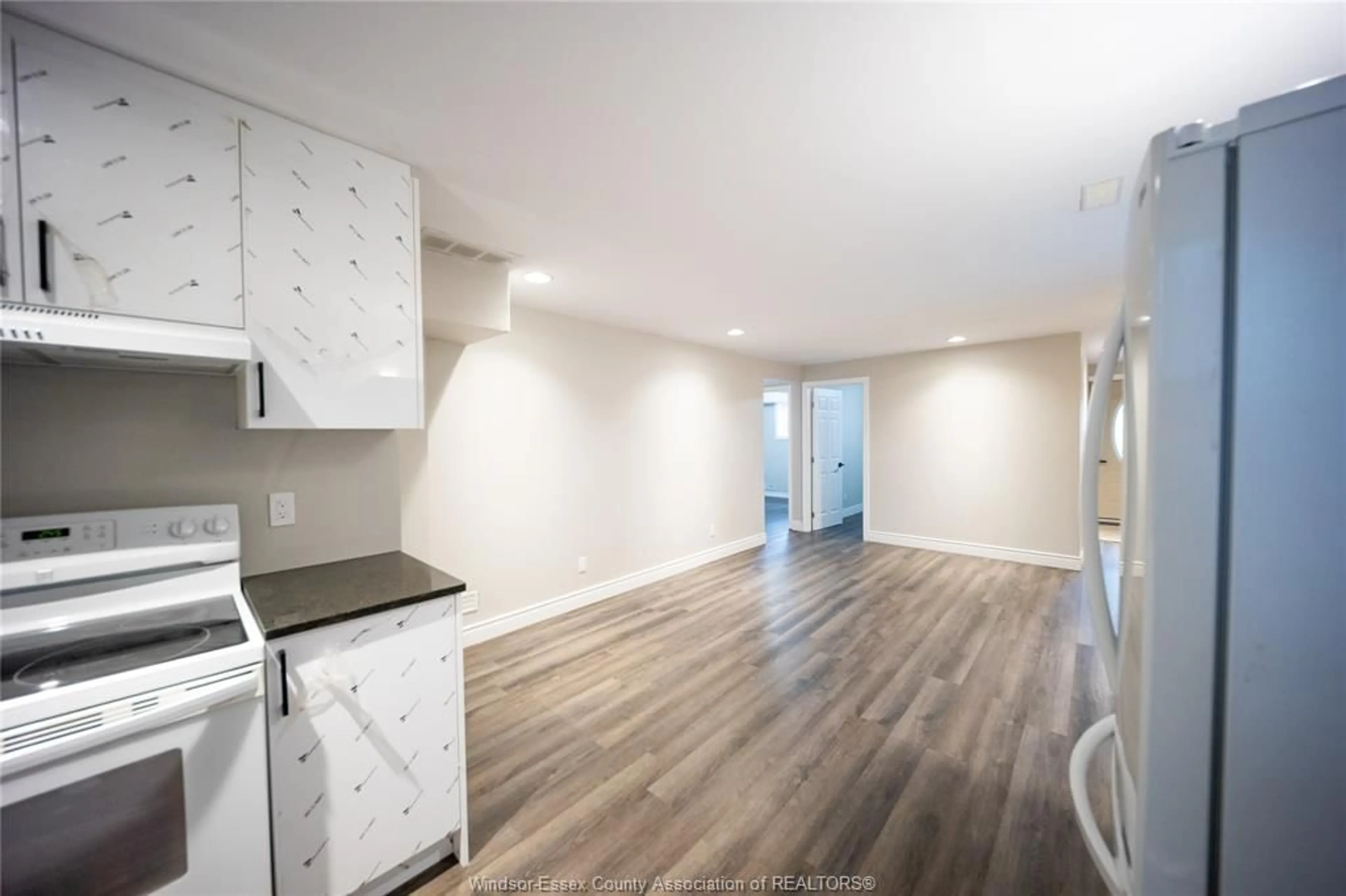 Open concept kitchen, wood/laminate floor for 460 MERRILL Ave, LaSalle Ontario N9H 3N7