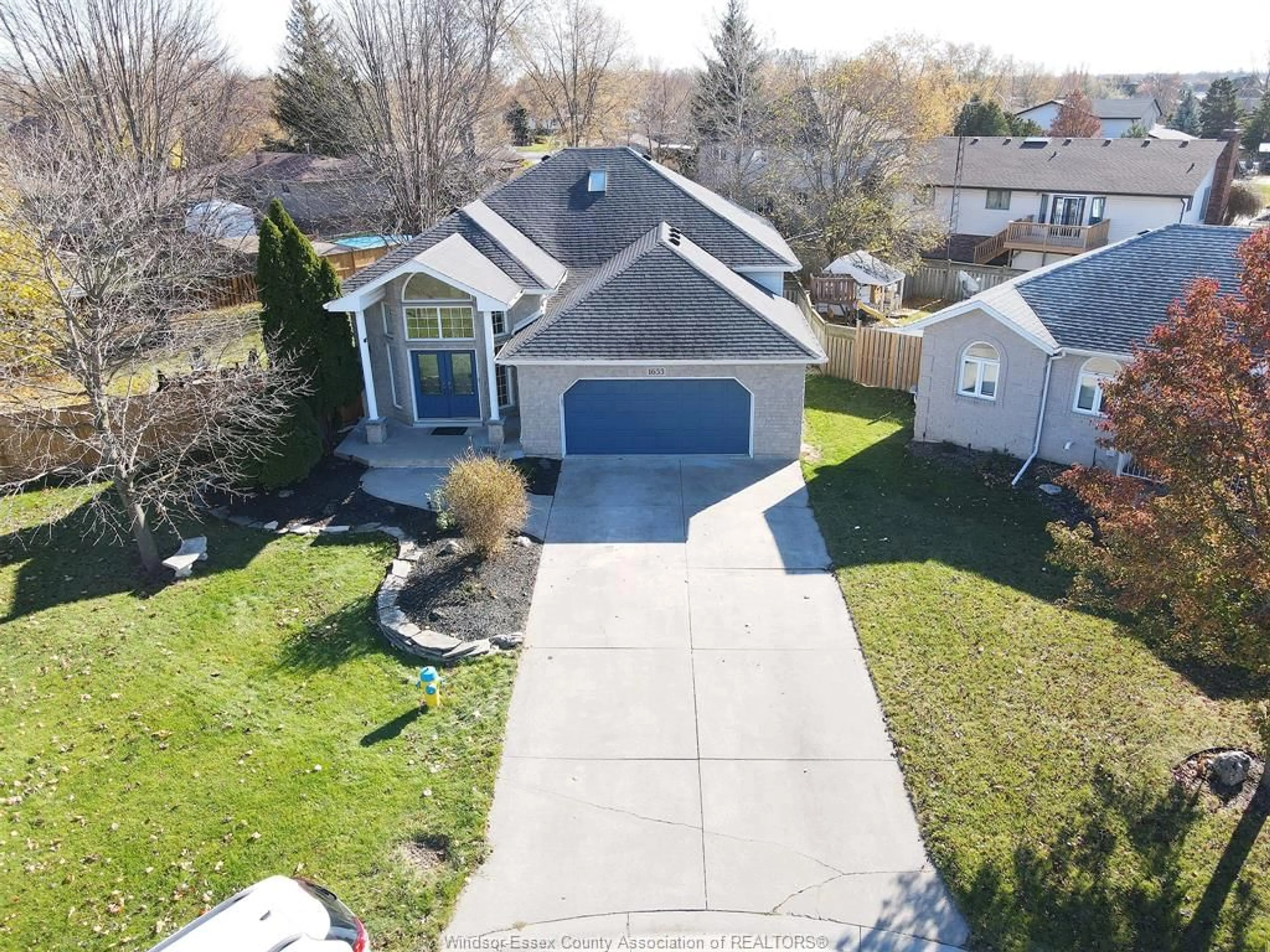 A pic from outside/outdoor area/front of a property/back of a property/a pic from drone, street for 1633 CHERRYWOOD St, Lakeshore Ontario N0R 1A0