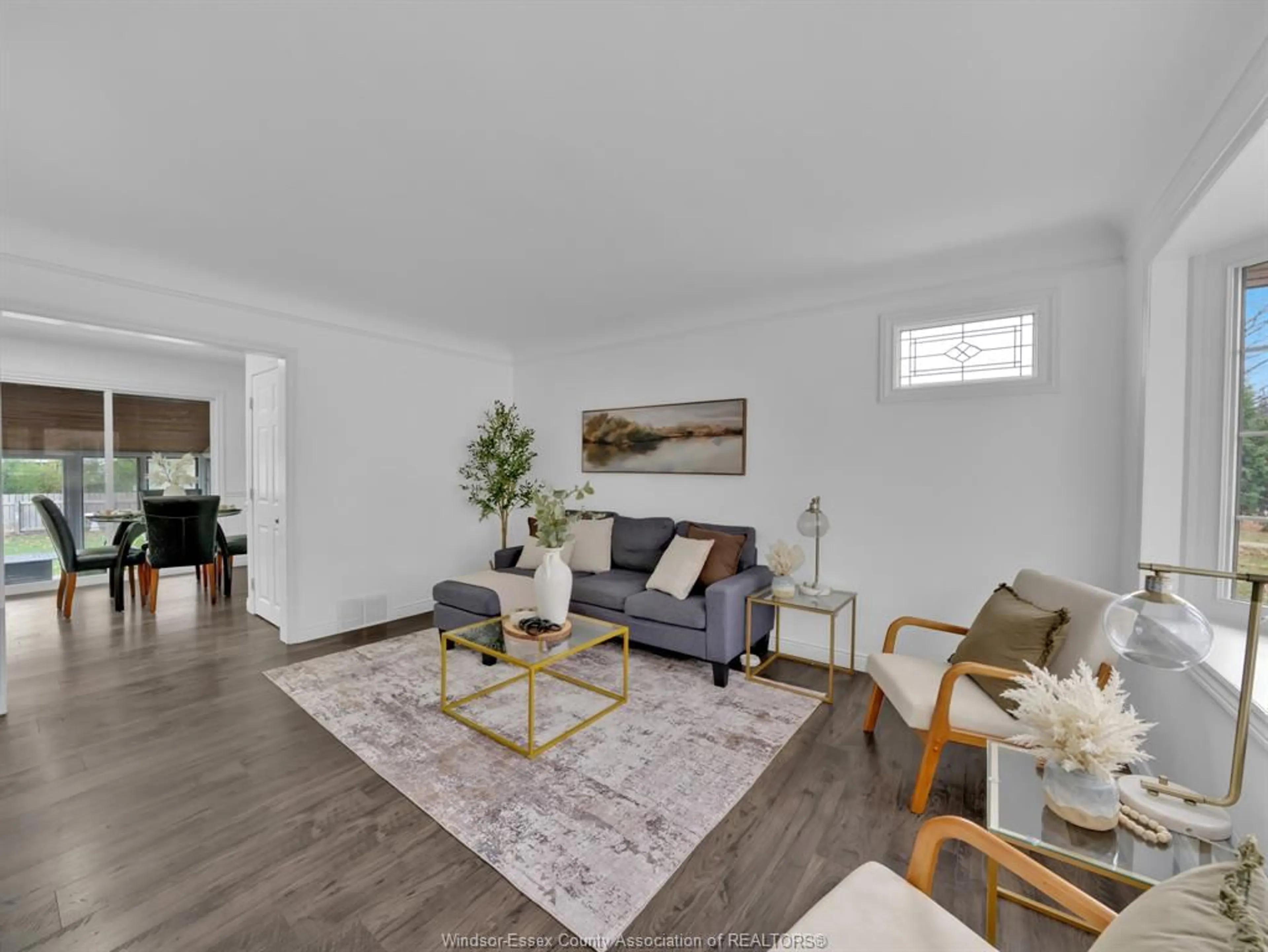 Living room with furniture, wood/laminate floor for 3312 MCKAY Ave, Windsor Ontario N9E 2R5