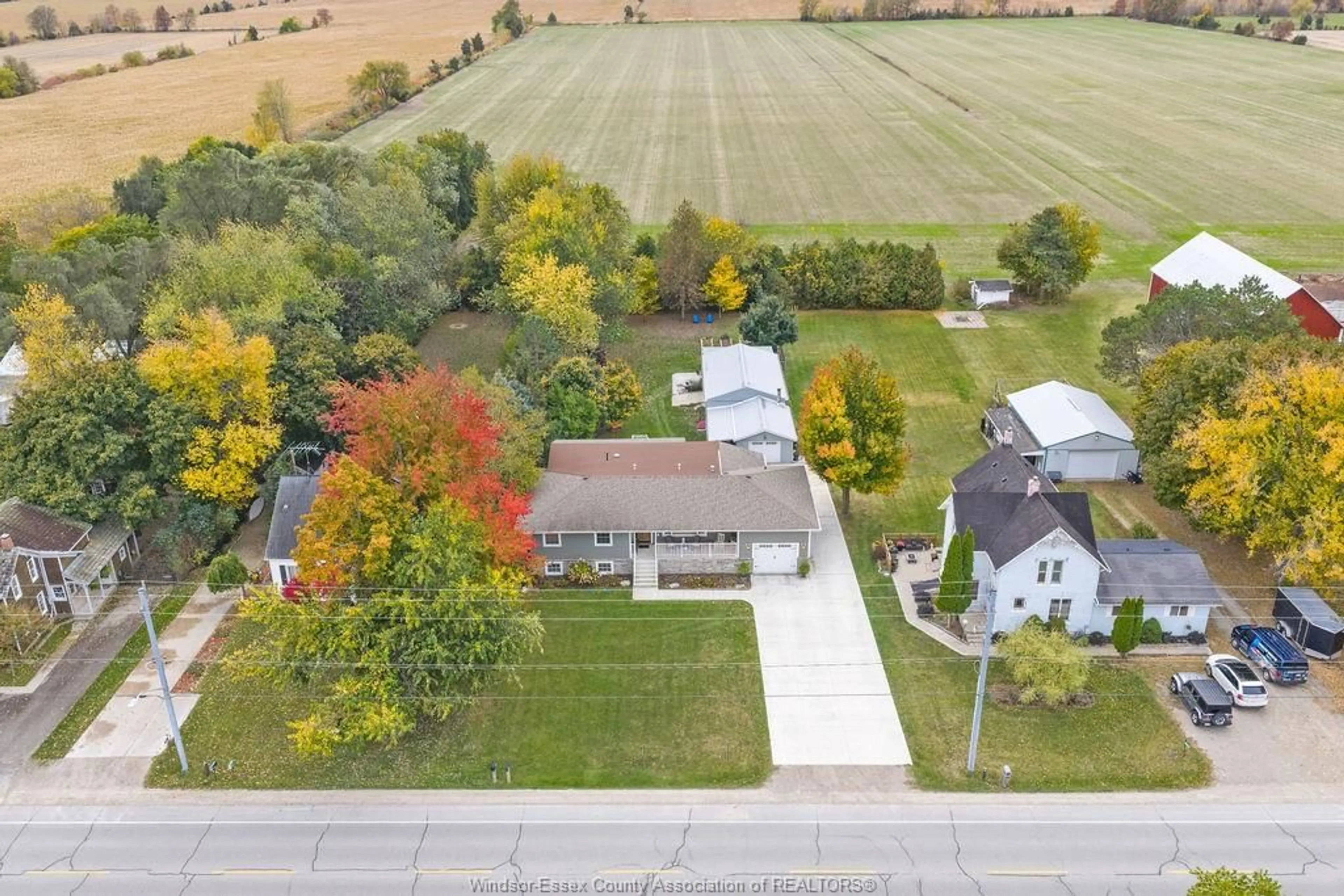 A pic from outside/outdoor area/front of a property/back of a property/a pic from drone, street for 215 COUNTY RD 34, Cottam Ontario N8M 2X5