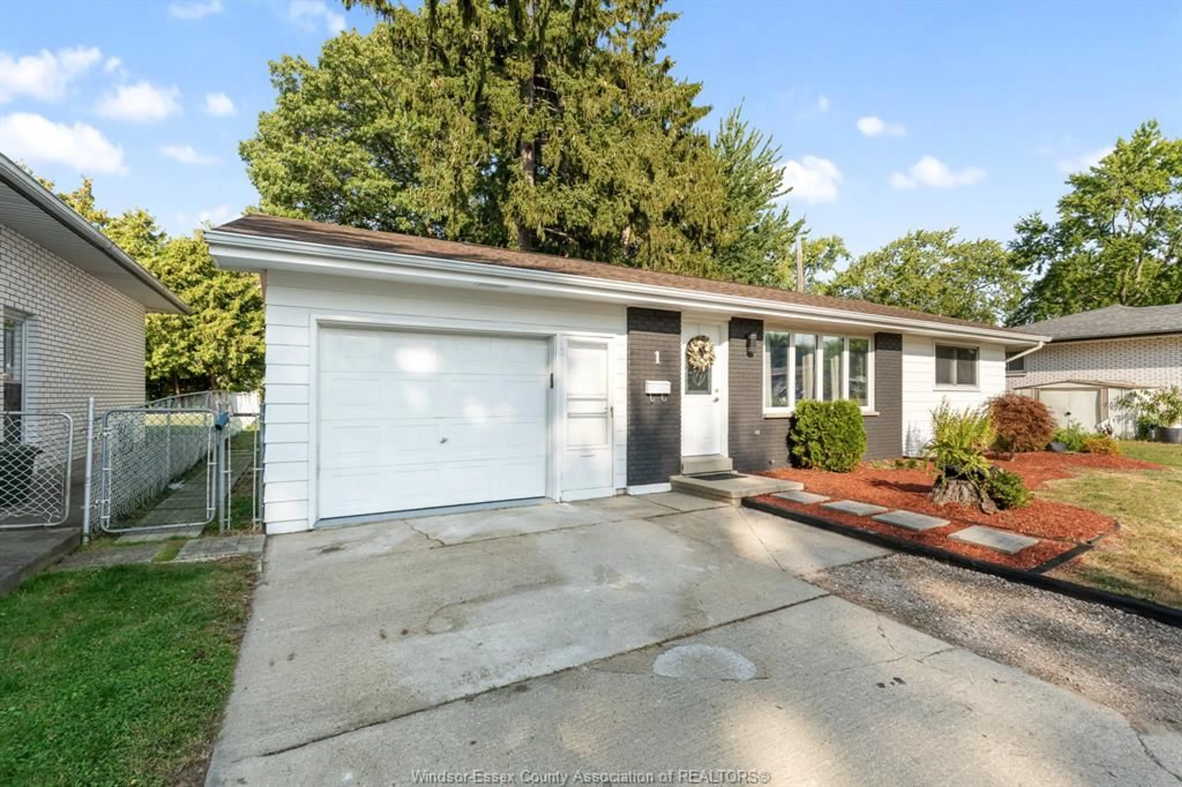 Home with vinyl exterior material, street for 1 LONGFIELD Lane, Leamington Ontario N8H 2R8