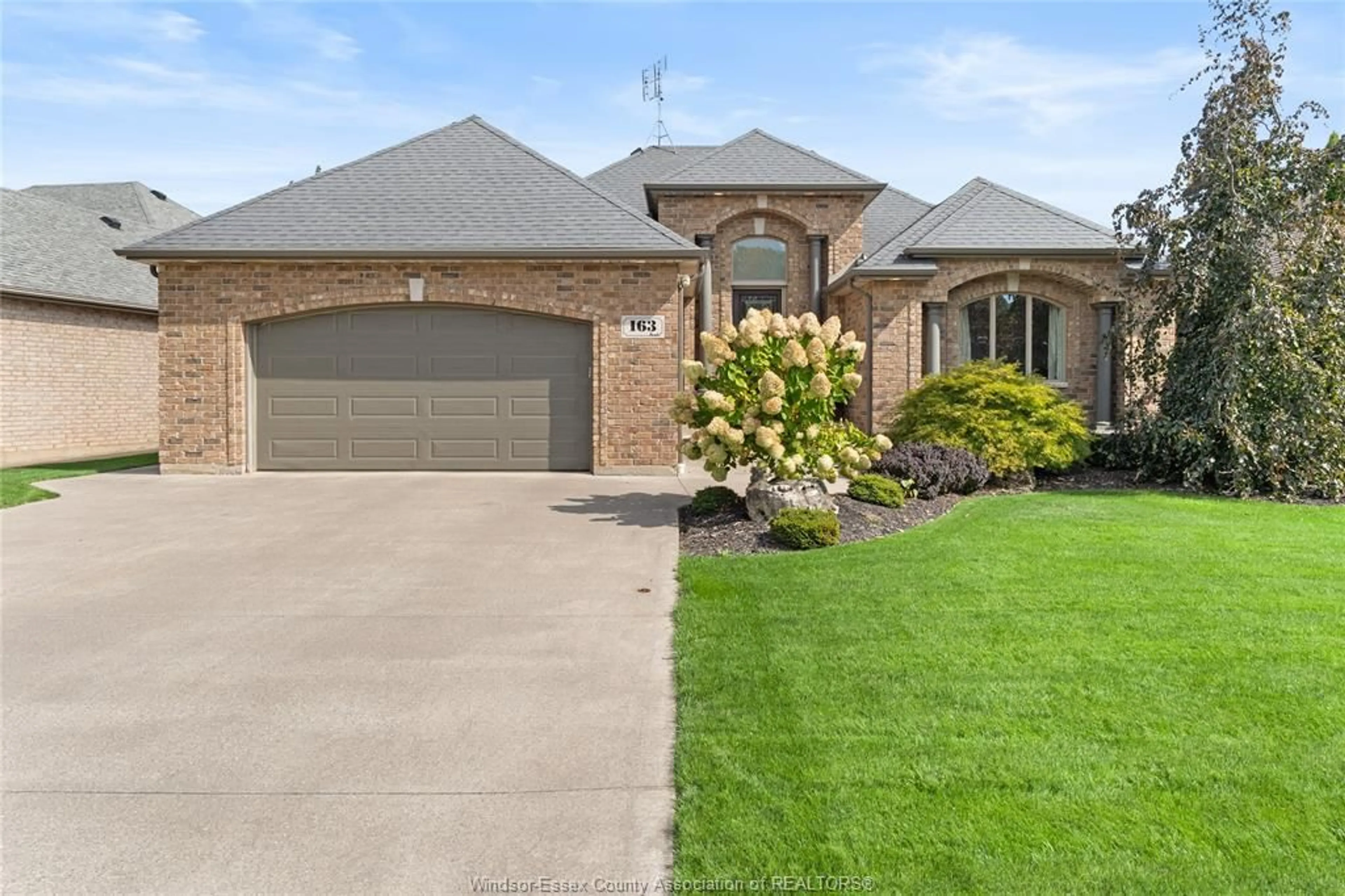 Home with brick exterior material, street for 163 WOODYCREST, Kingsville Ontario N9Y 0A1