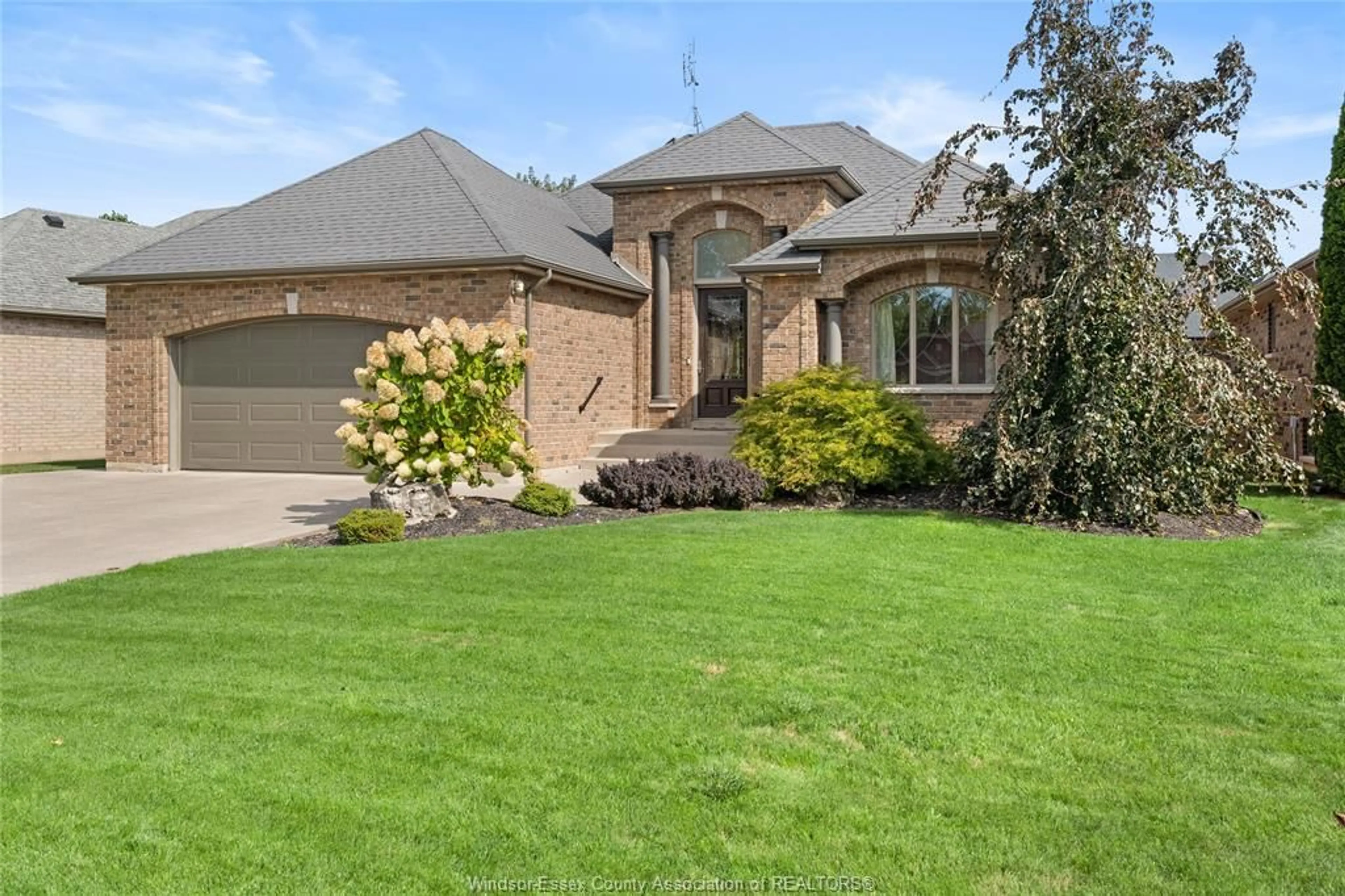 Home with brick exterior material, street for 163 WOODYCREST, Kingsville Ontario N9Y 0A1