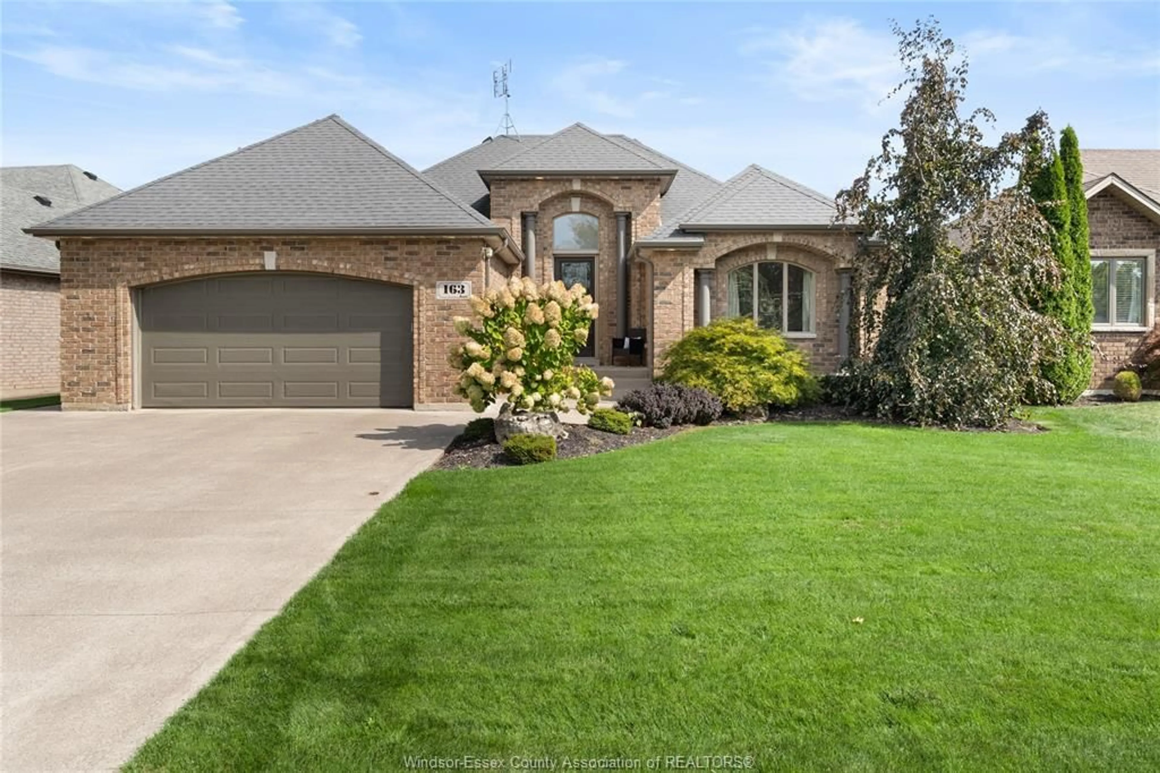 Home with brick exterior material, street for 163 WOODYCREST, Kingsville Ontario N9Y 0A1