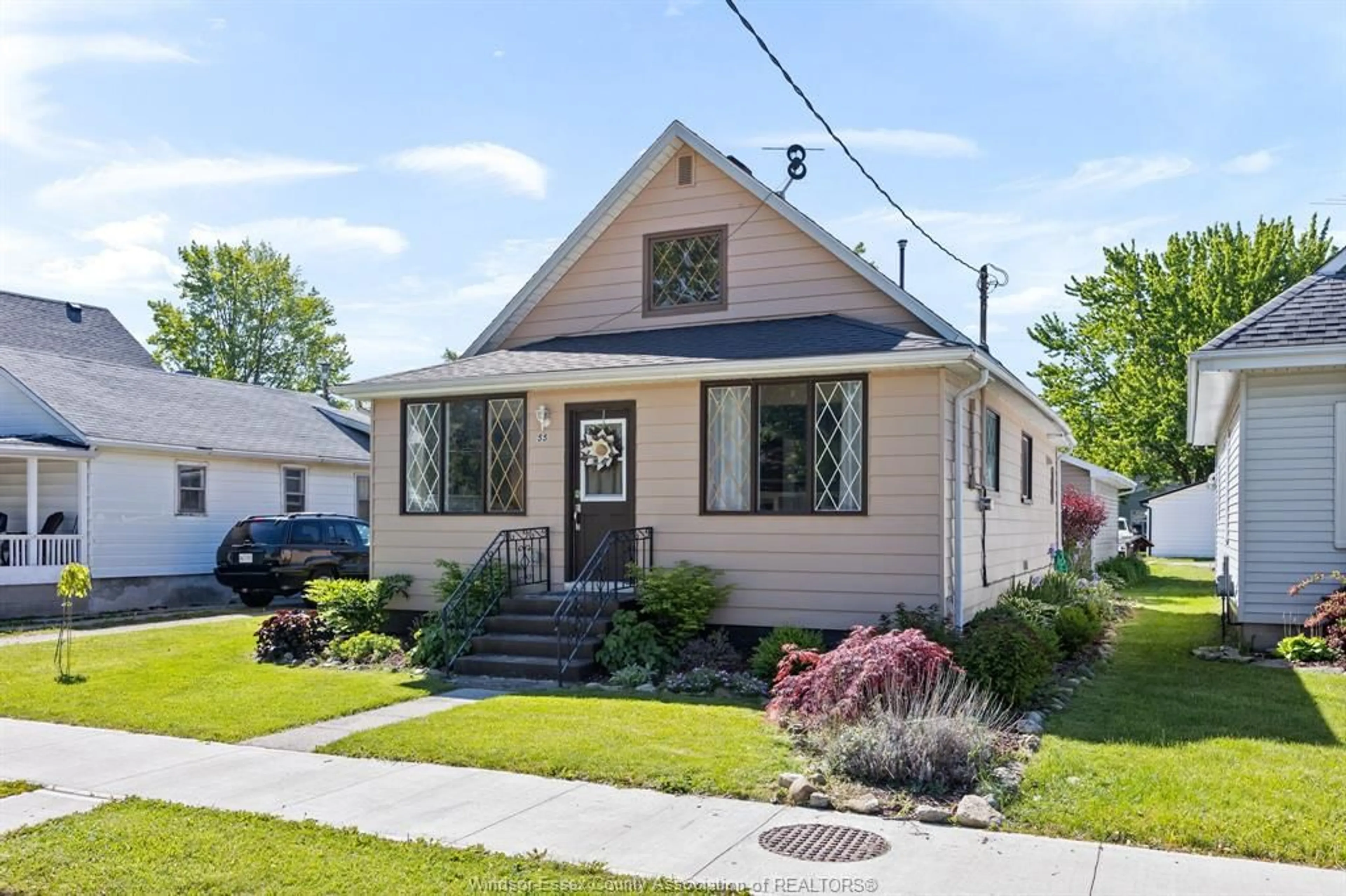 Home with vinyl exterior material, street for 55 CANAL, Tilbury Ontario N0P 2L0