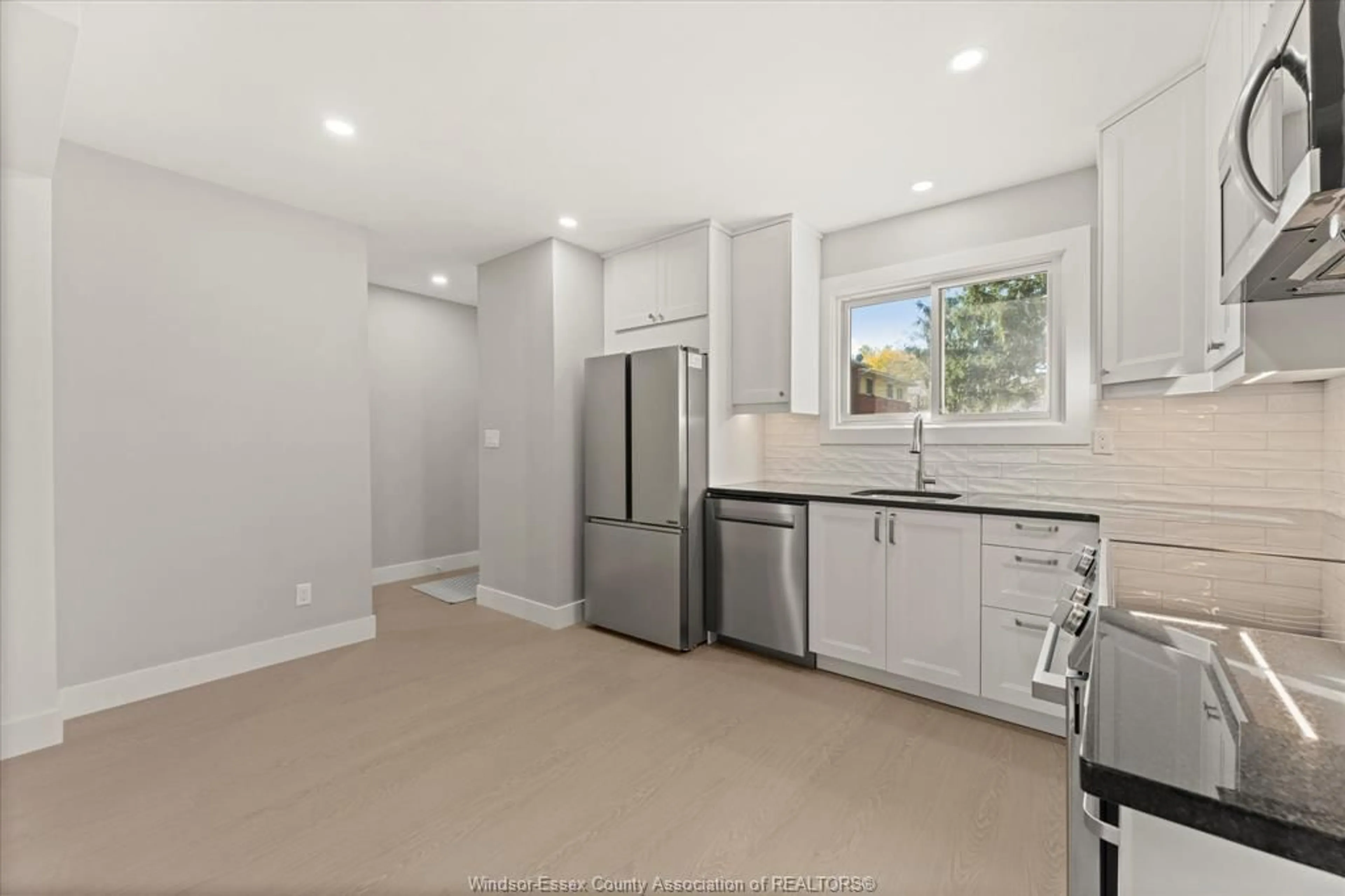 Open concept kitchen, ceramic/tile floor for 2960 MEADOWBROOK Lane #2, Windsor Ontario N8T 3C8