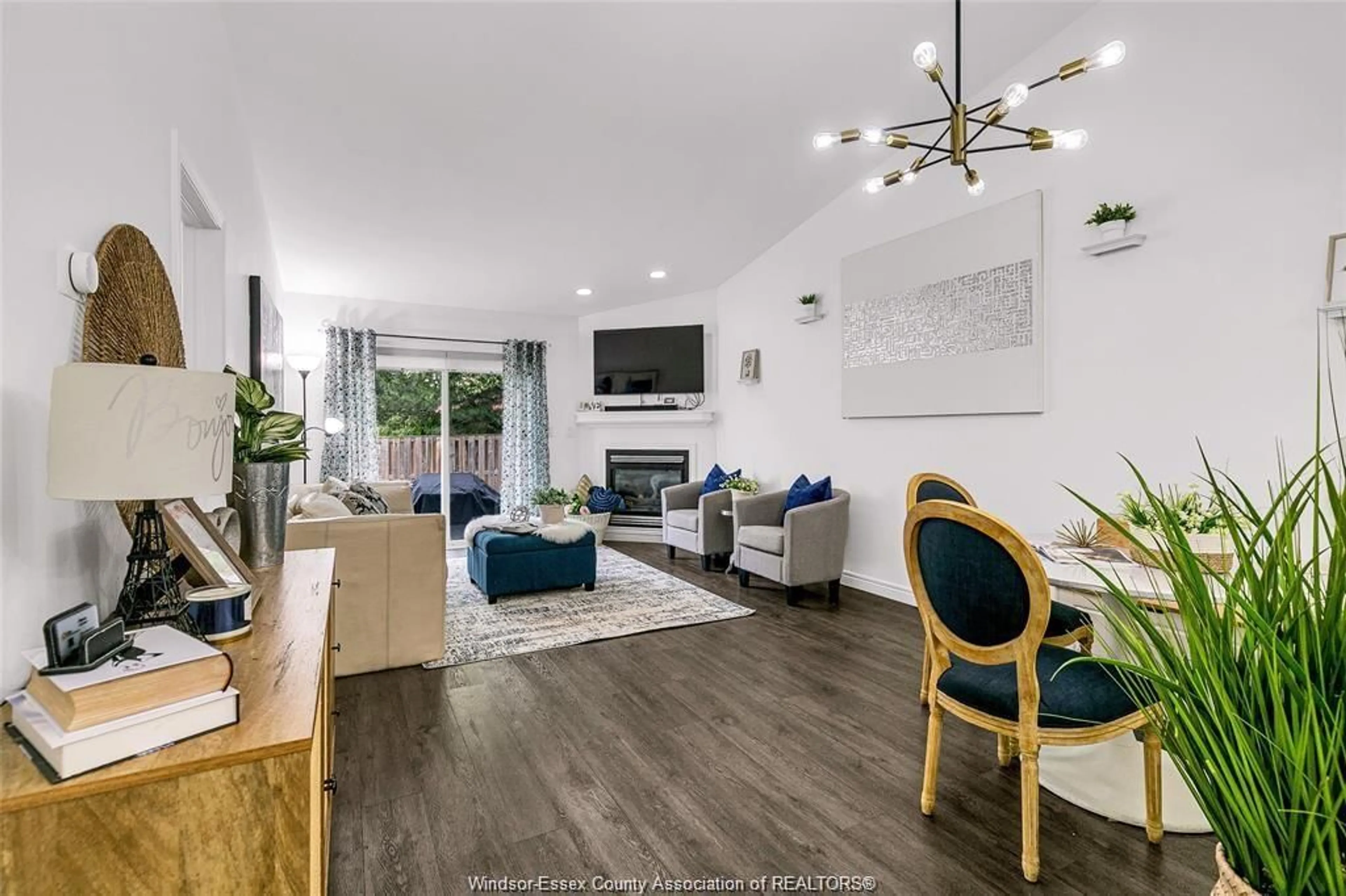 Living room with furniture, wood/laminate floor for 3772 PRAIRIE Crt, Windsor Ontario N9G 2X3