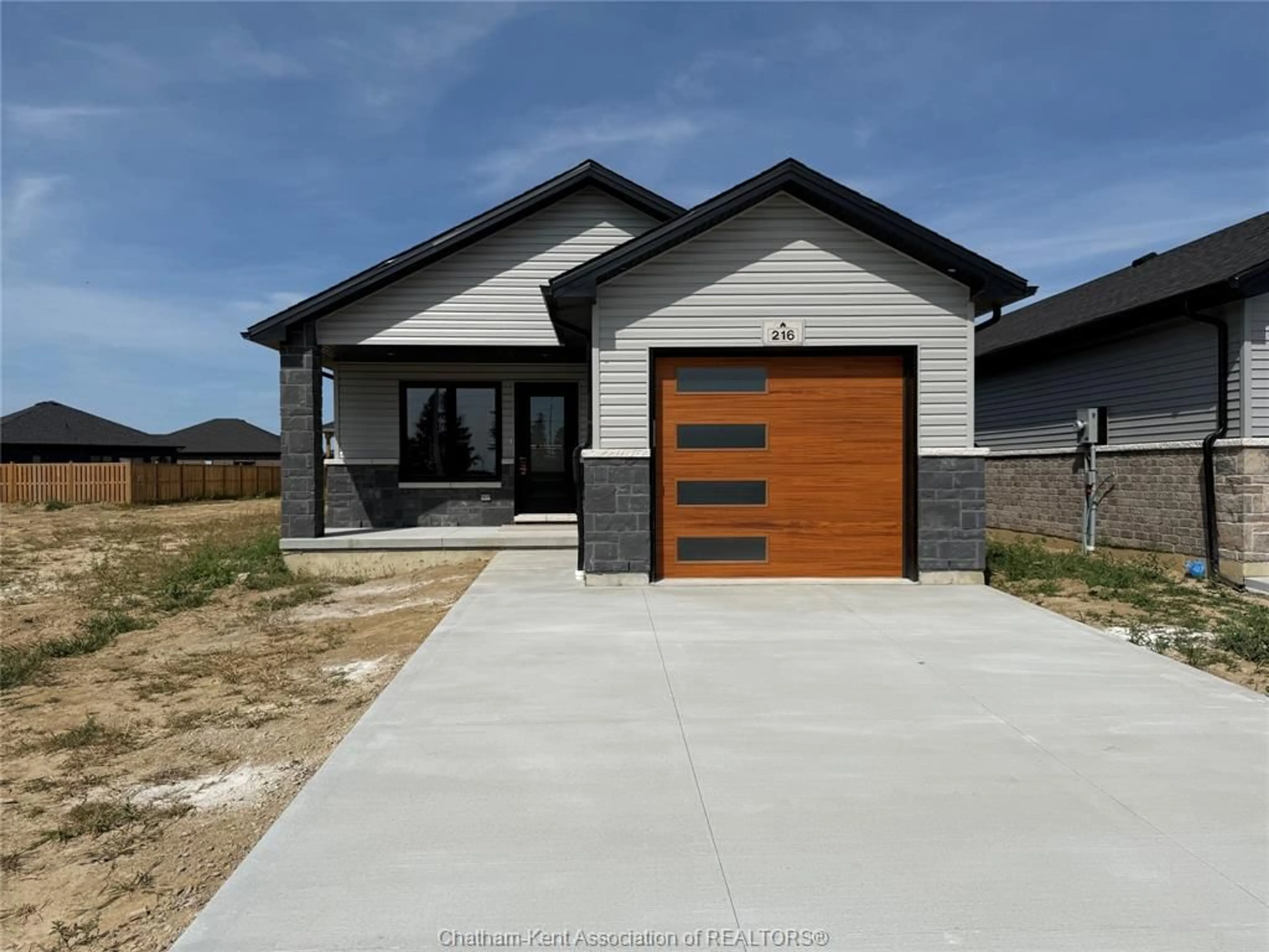 Home with brick exterior material, street for 216 IRONWOOD Trail, Chatham Ontario N7M 0T3