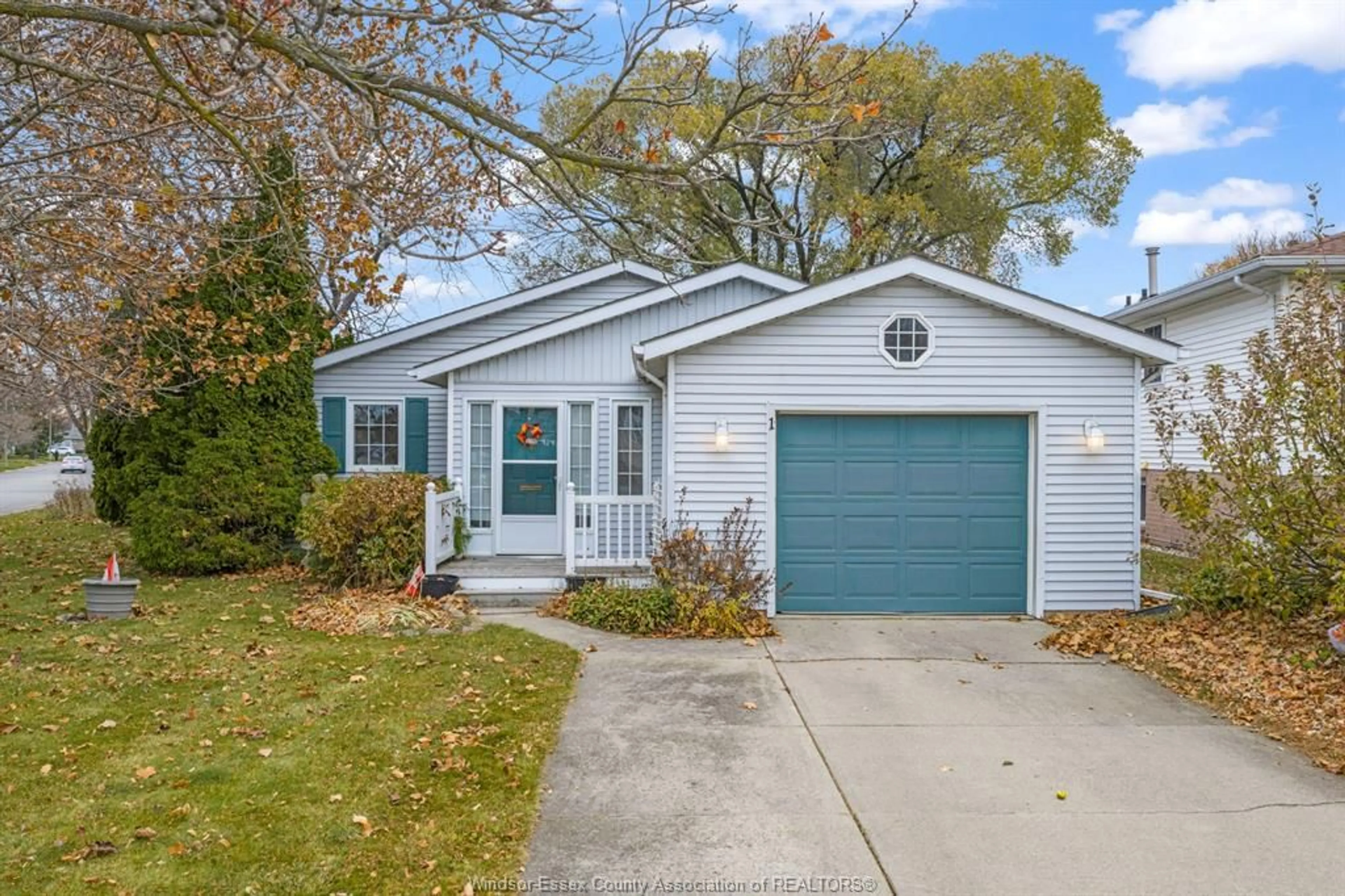 Home with vinyl exterior material, street for 1 Eastern Ave, Leamington Ontario N8H 4X8