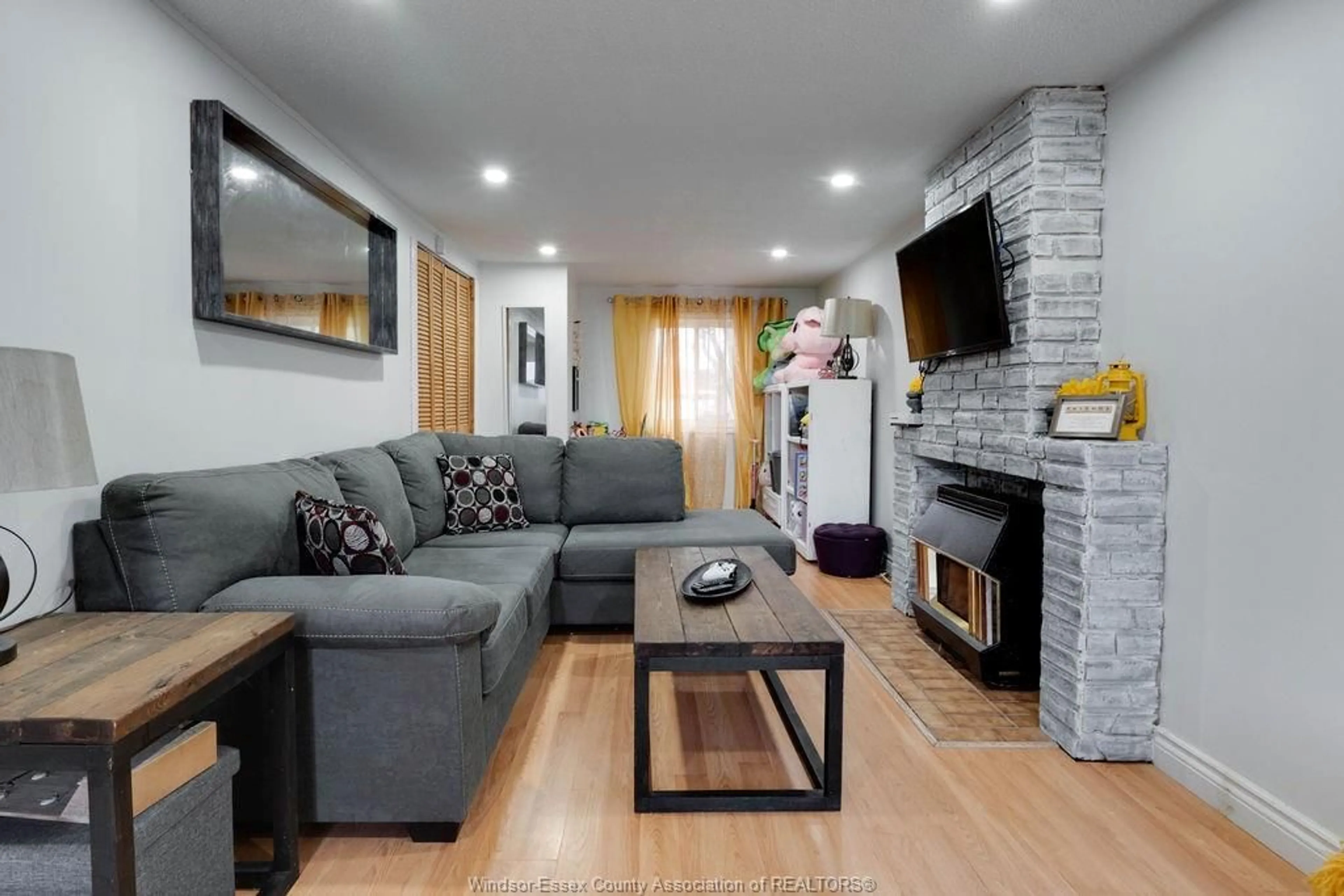 Living room with furniture, wood/laminate floor for 876 WESTMINSTER, Windsor Ontario N8S 2C1