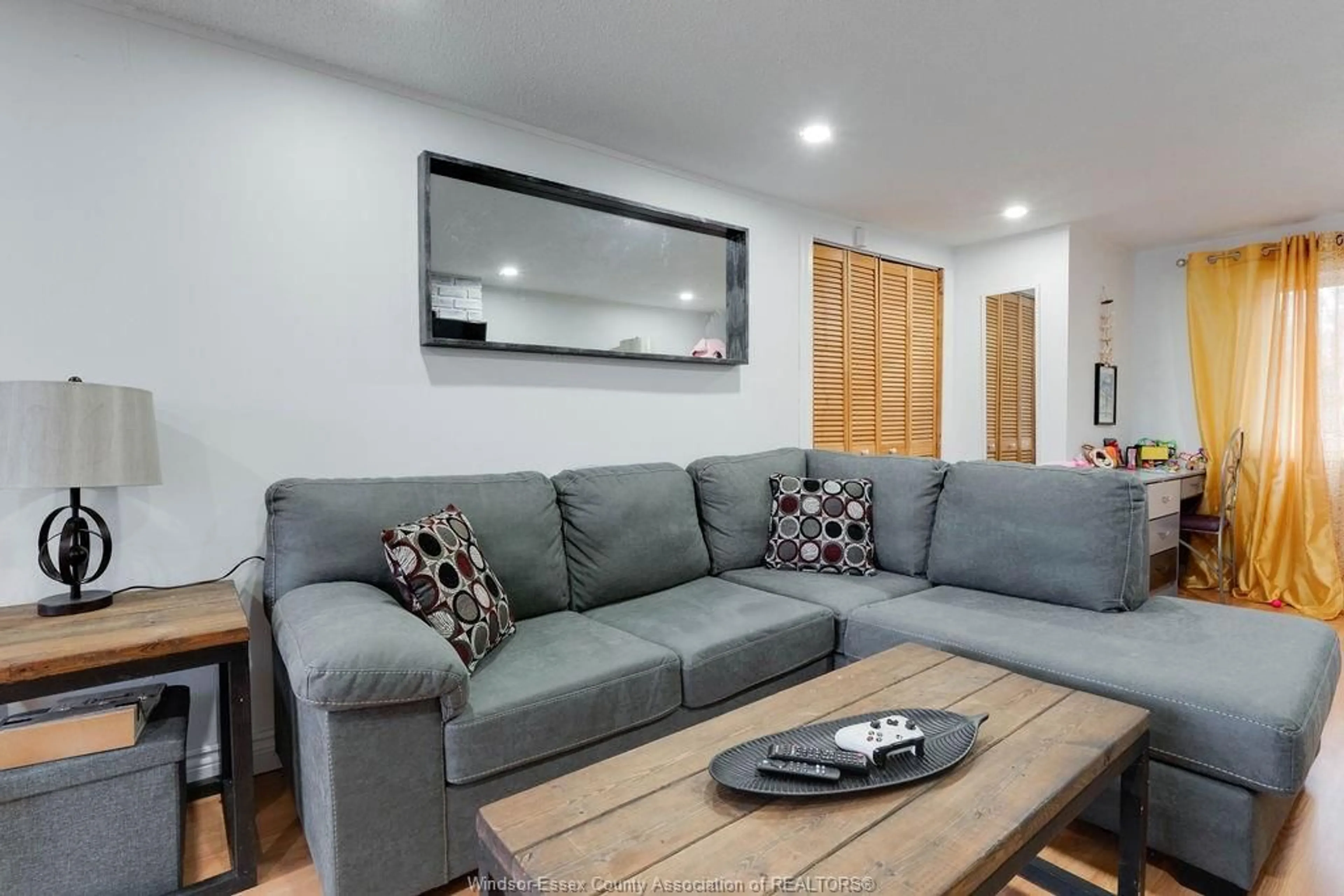 Living room with furniture, wood/laminate floor for 876 WESTMINSTER, Windsor Ontario N8S 2C1