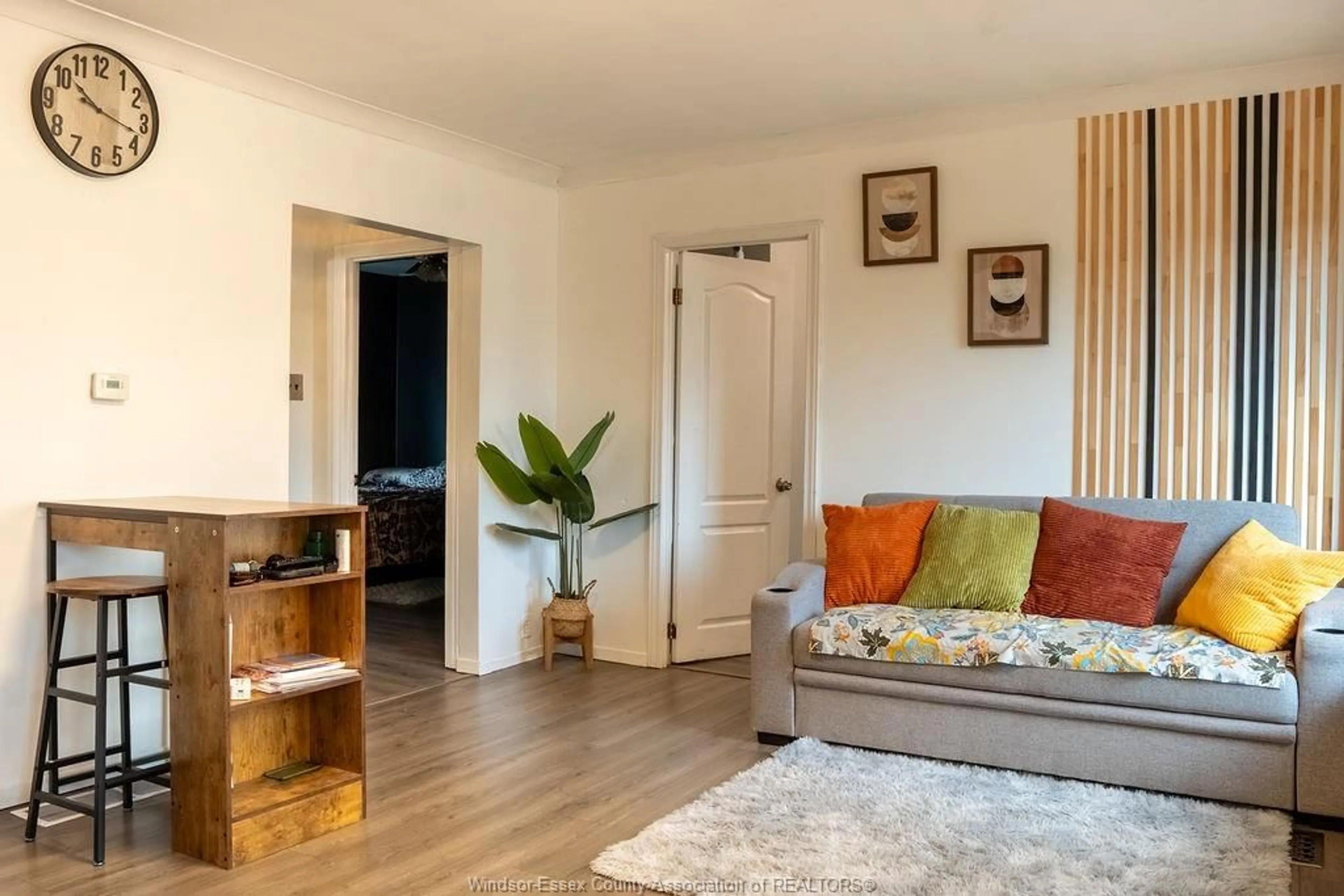 Living room with furniture, wood/laminate floor for 1709 Cadillac, Windsor Ontario N8Y 2V7