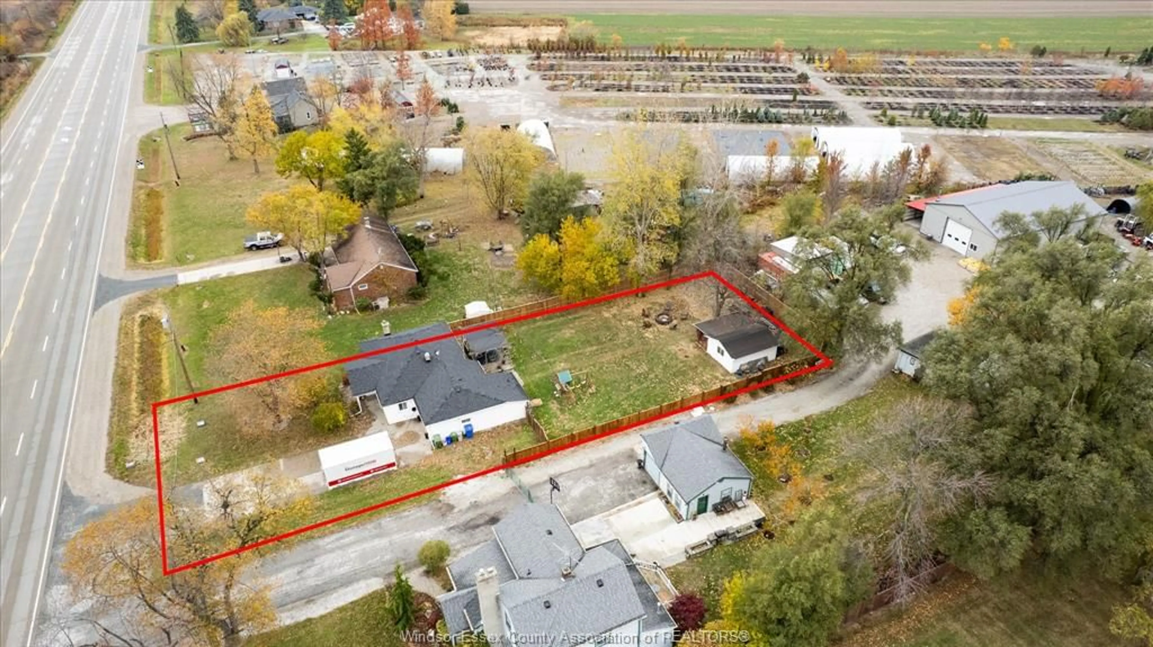 A pic from outside/outdoor area/front of a property/back of a property/a pic from drone, street for 7092 HIGHWAY #3, Tecumseh Ontario N0R 1K0