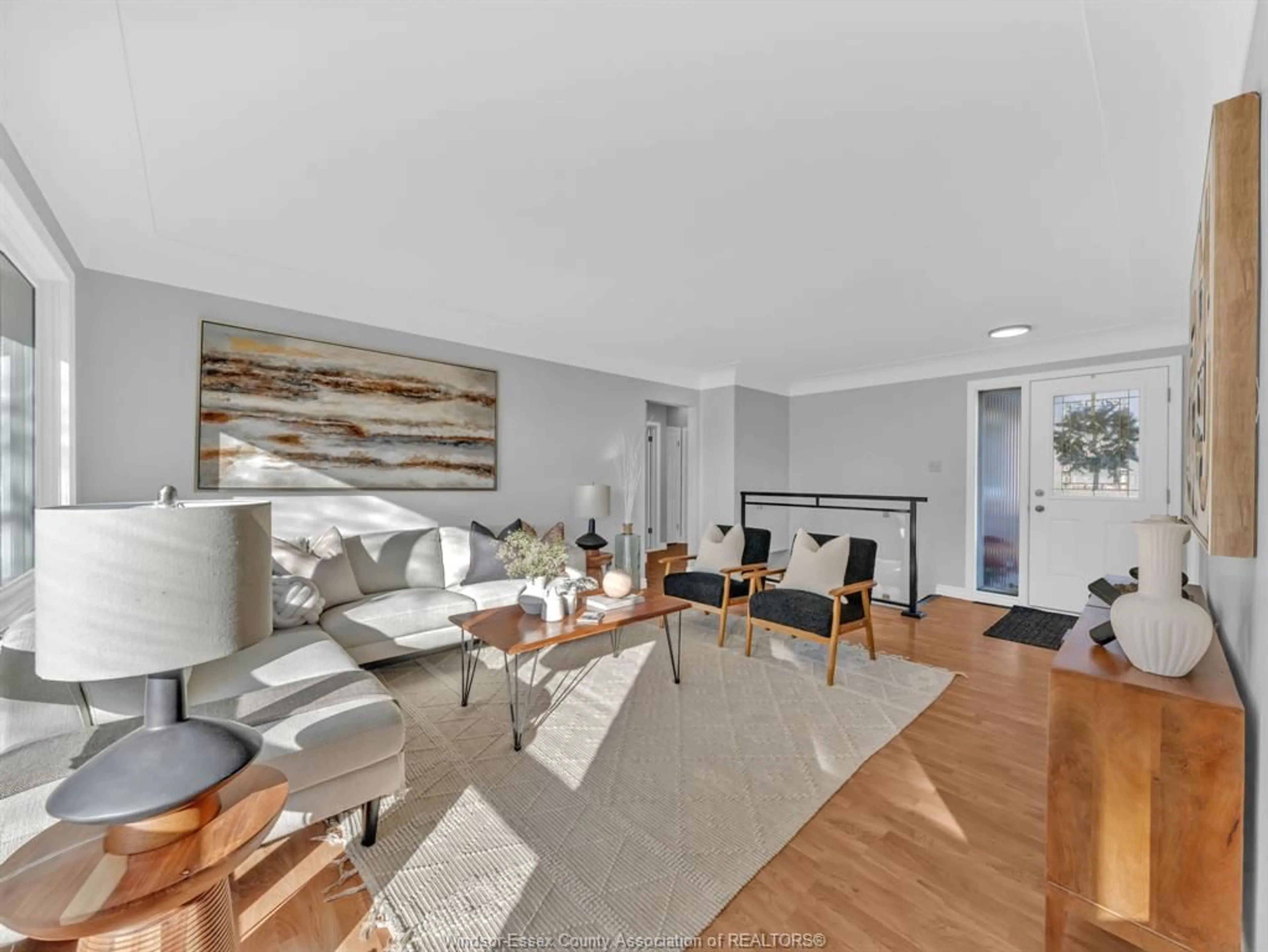 Living room with furniture, wood/laminate floor for 8 Gladstone Ave, Leamington Ontario N8H 2H5