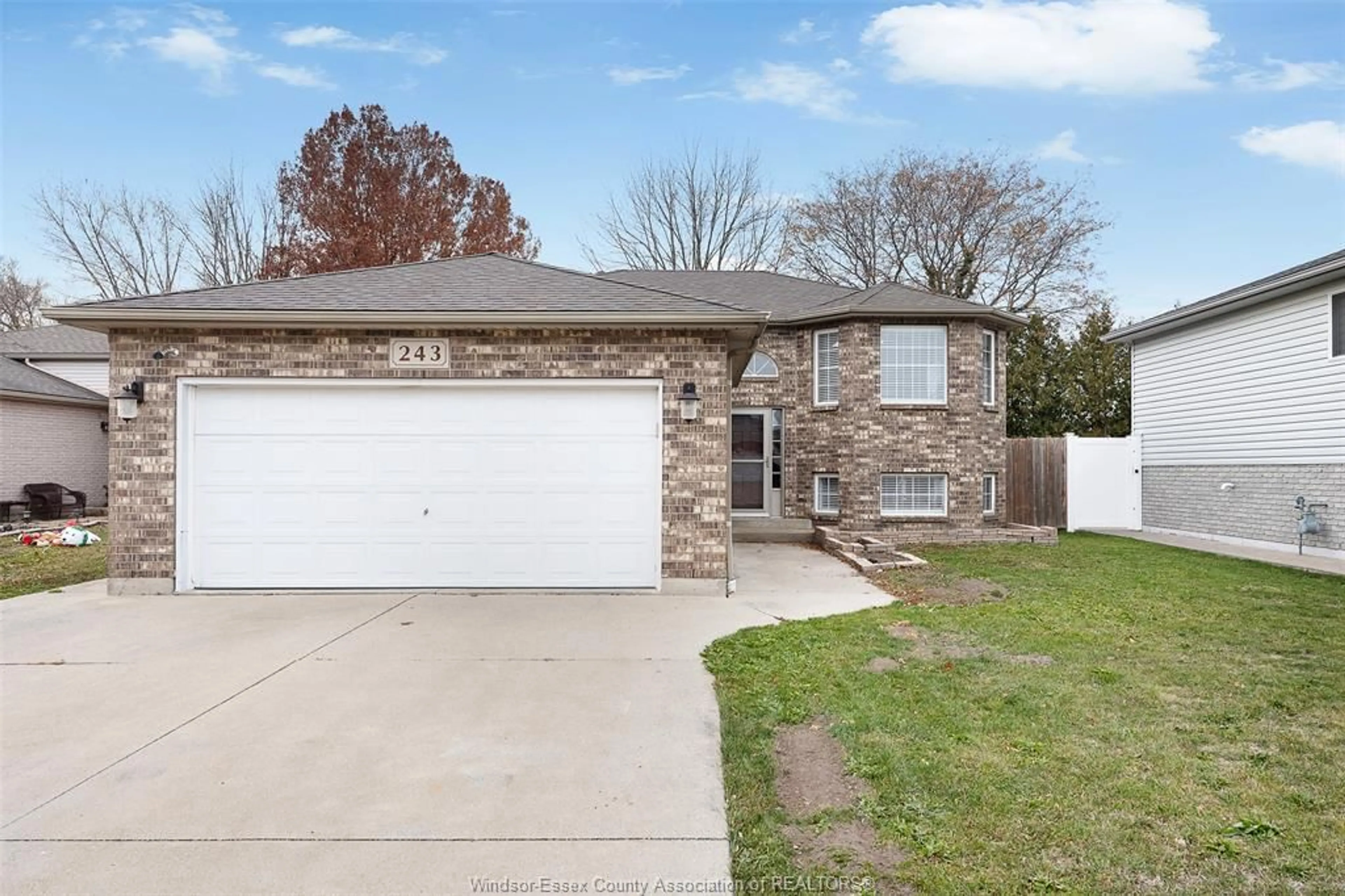 Home with brick exterior material, street for 243 GAMMON Cres, Lakeshore Ontario N0R 1A0