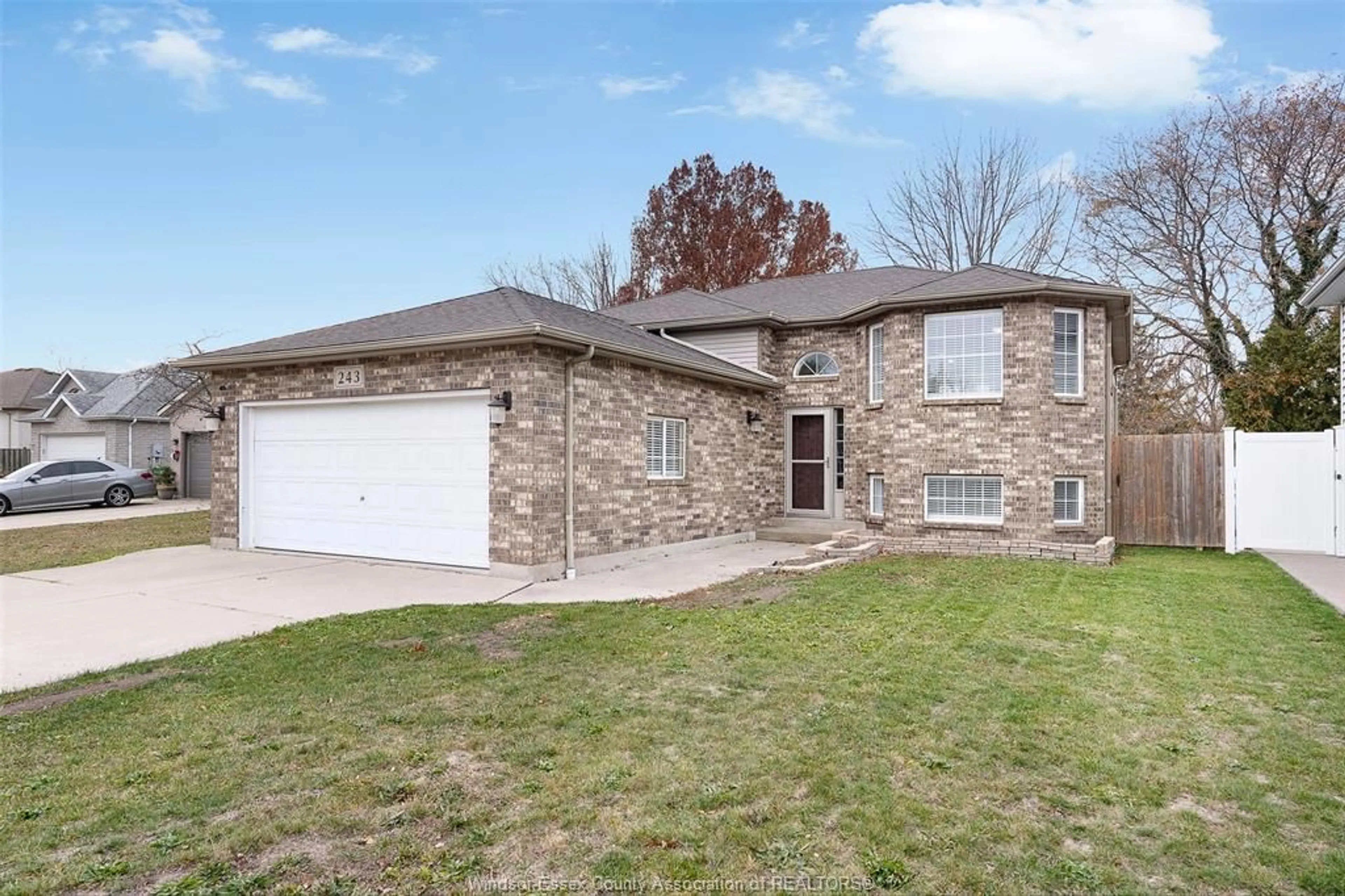 Home with brick exterior material, street for 243 GAMMON Cres, Lakeshore Ontario N0R 1A0