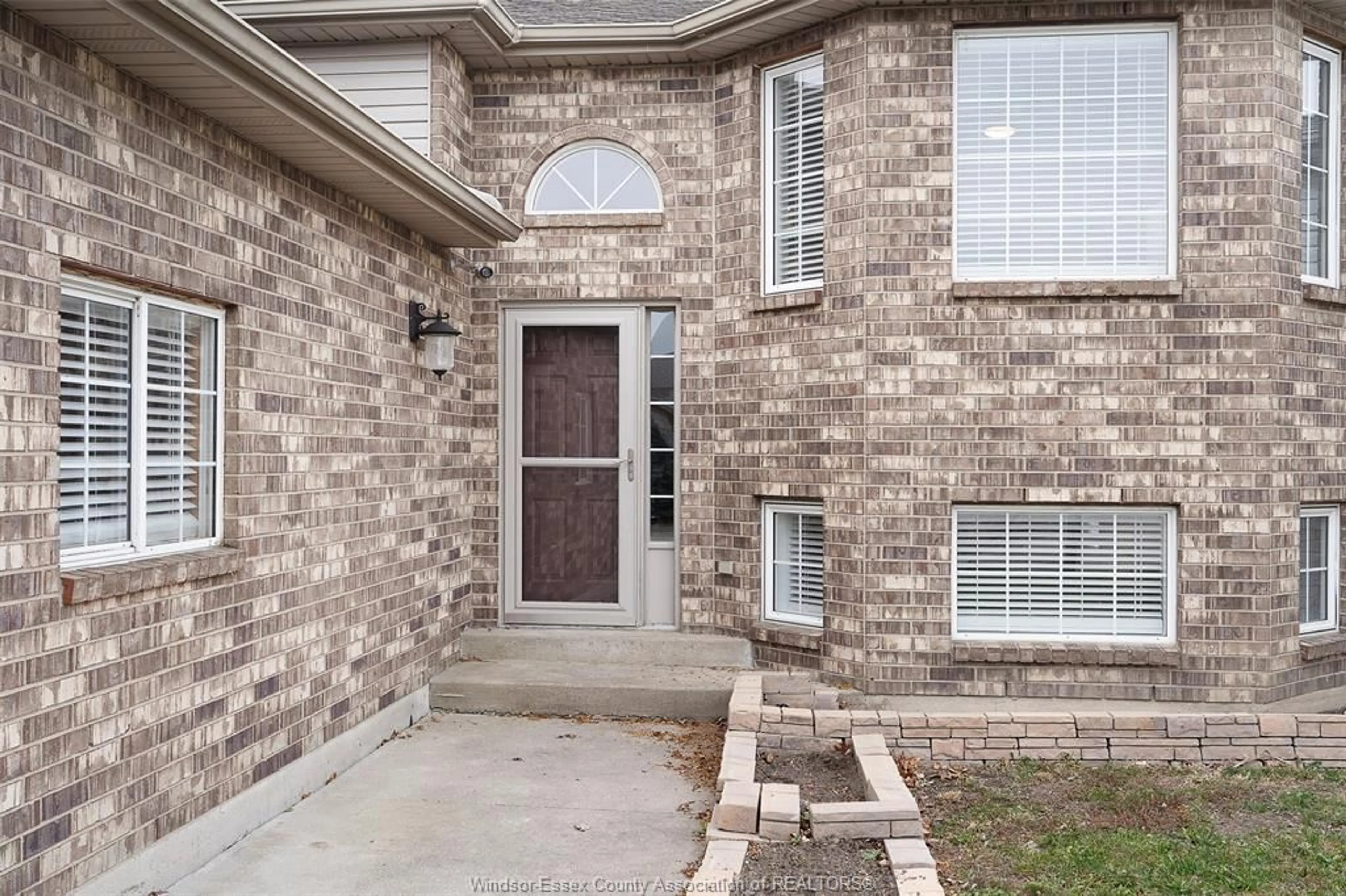 Home with brick exterior material, street for 243 GAMMON Cres, Lakeshore Ontario N0R 1A0