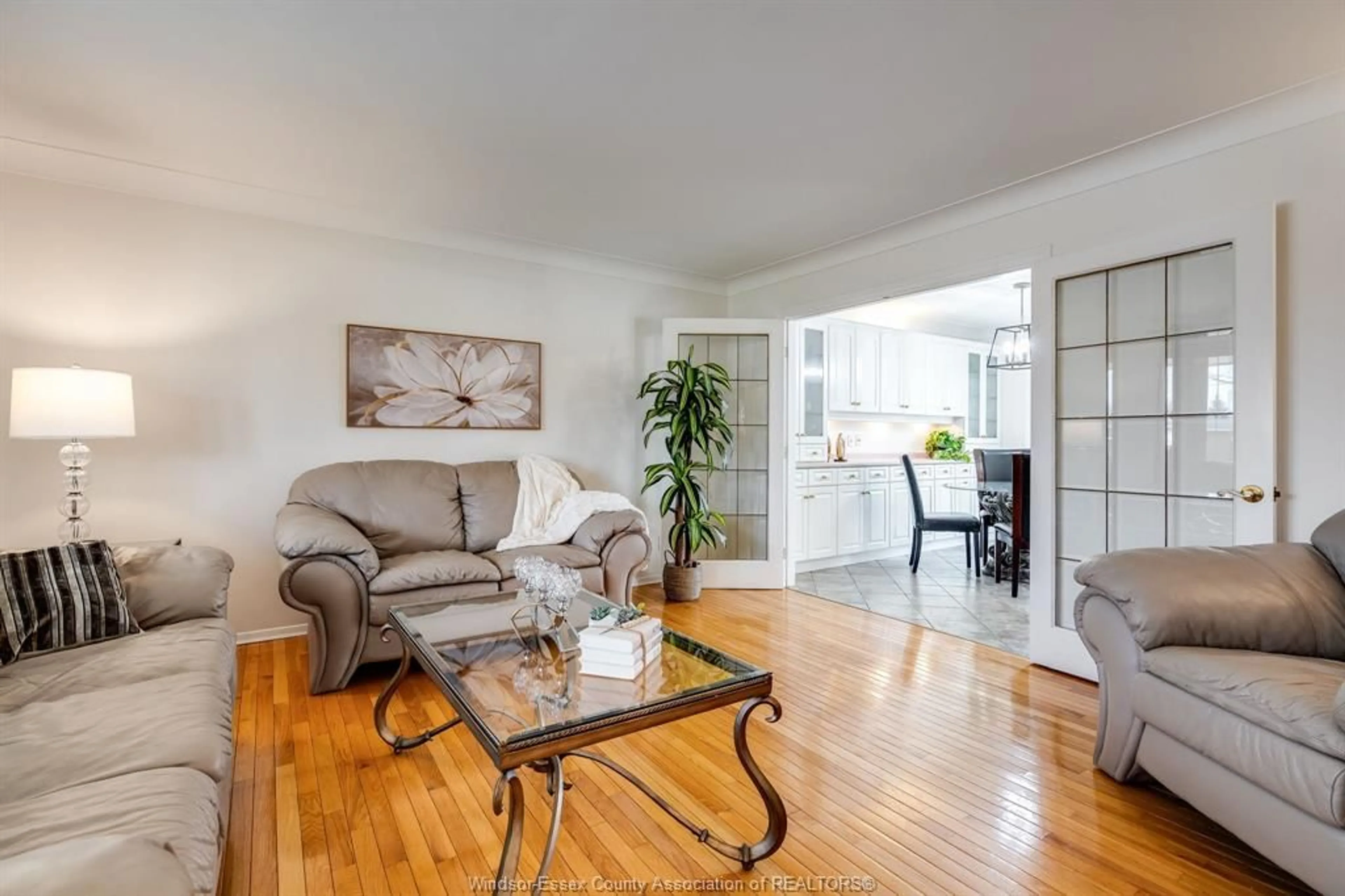 Living room with furniture, wood/laminate floor for 82 Venetian Dr, Amherstburg Ontario N9V 3A2