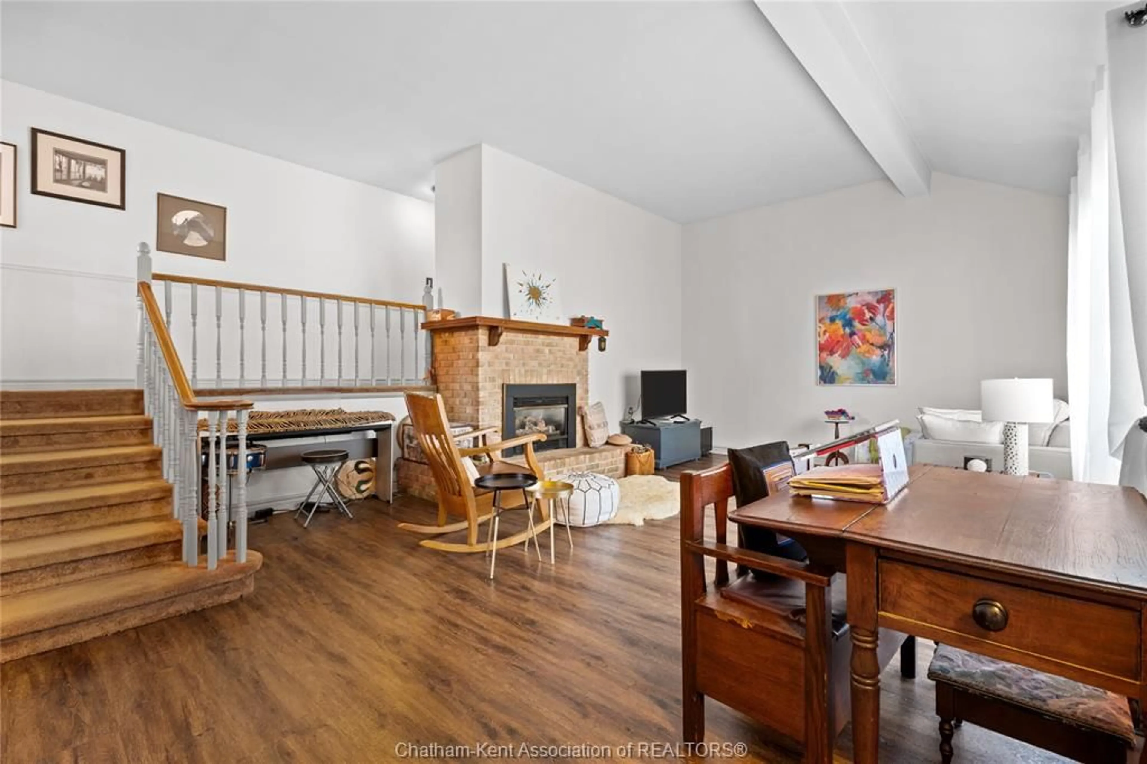 Living room with furniture, wood/laminate floor for 9164 Talbot Trail, Blenheim Ontario N0P 1A0