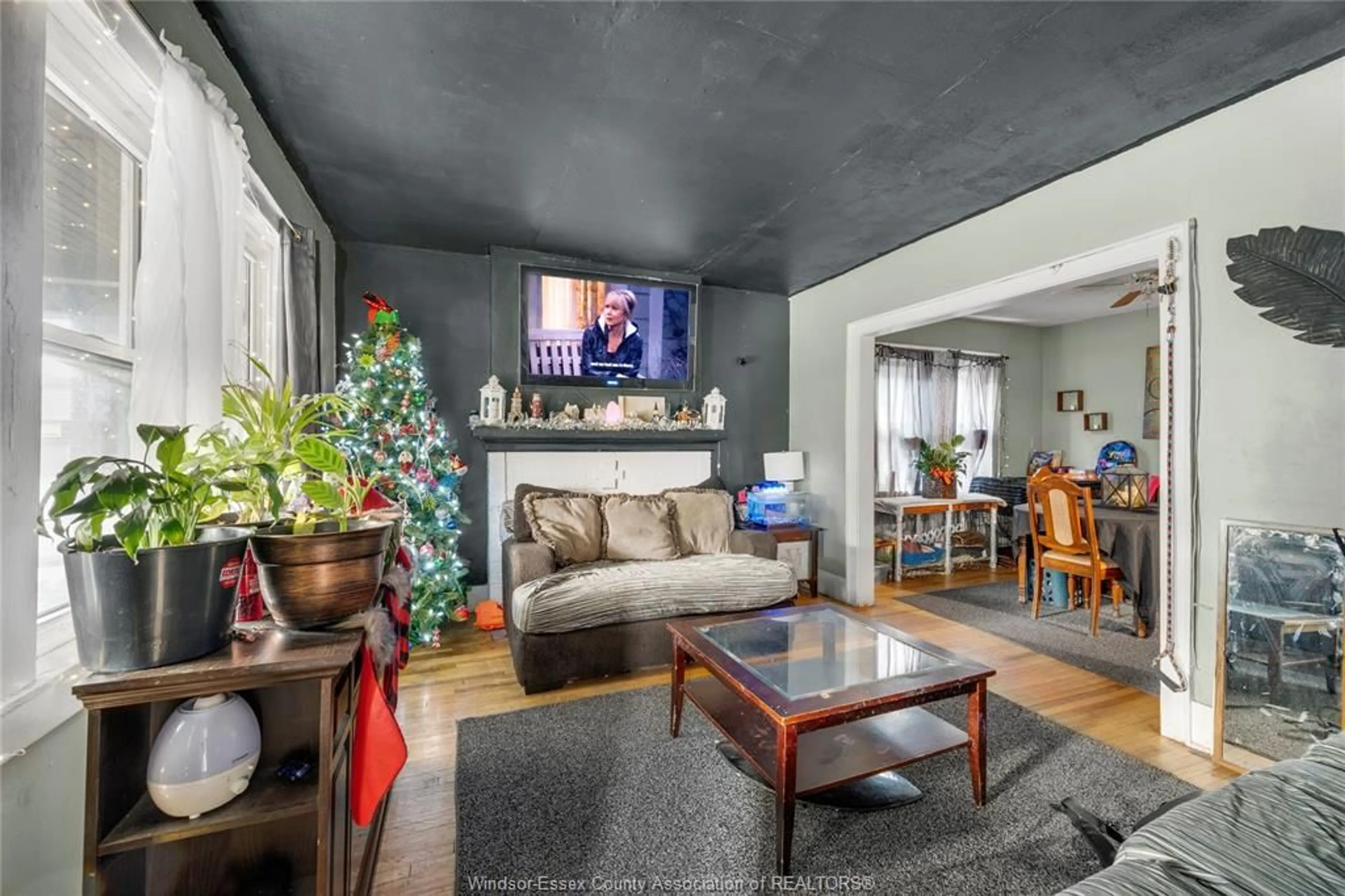 Living room with furniture, cement floor for 2224 Howard Ave, Windsor Ontario N8X 3V1