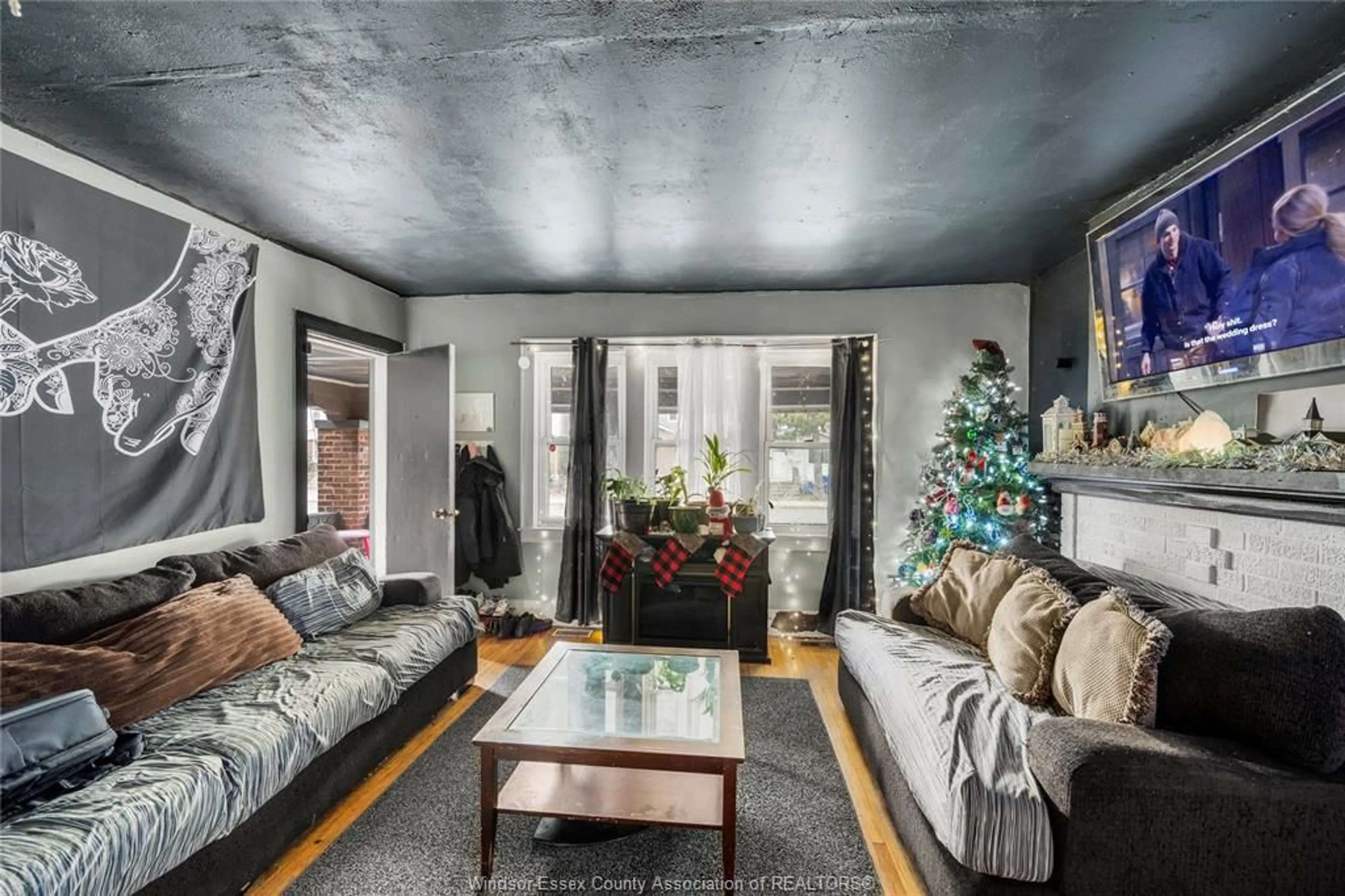 Living room with furniture, cement floor for 2224 Howard Ave, Windsor Ontario N8X 3V1