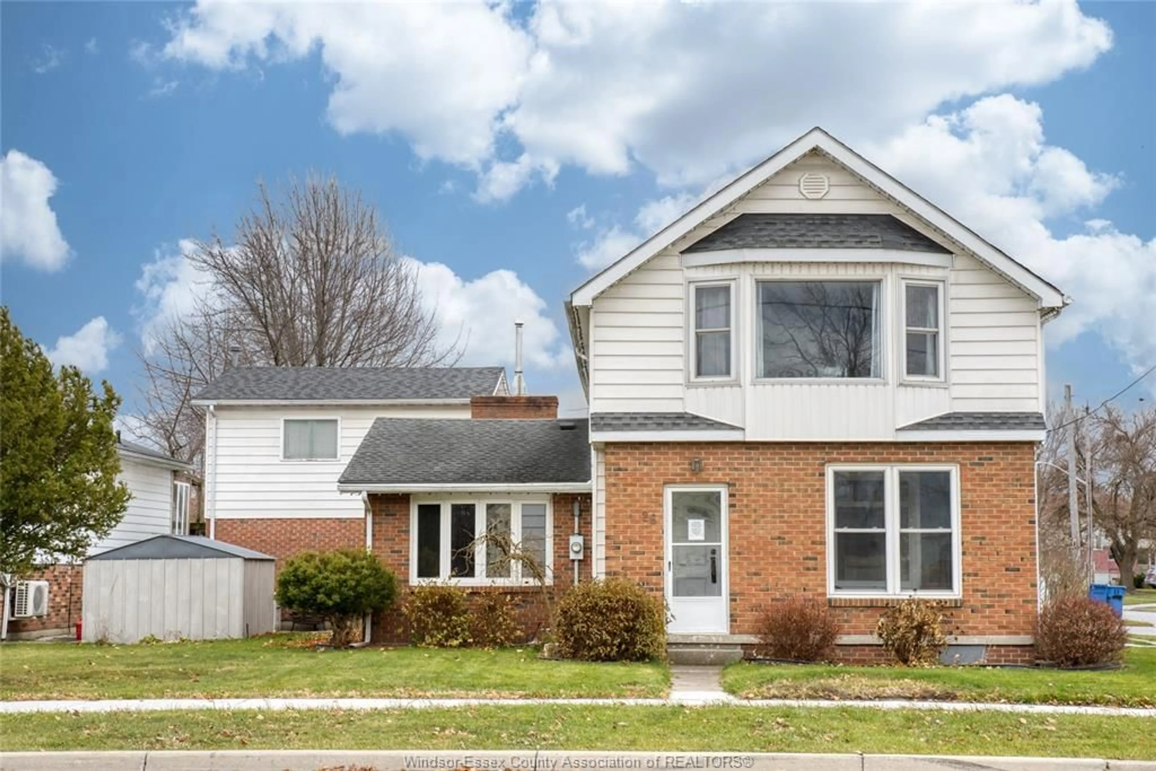 Home with vinyl exterior material, street for 26 LAIRD Ave, Essex Ontario N8M 1R6