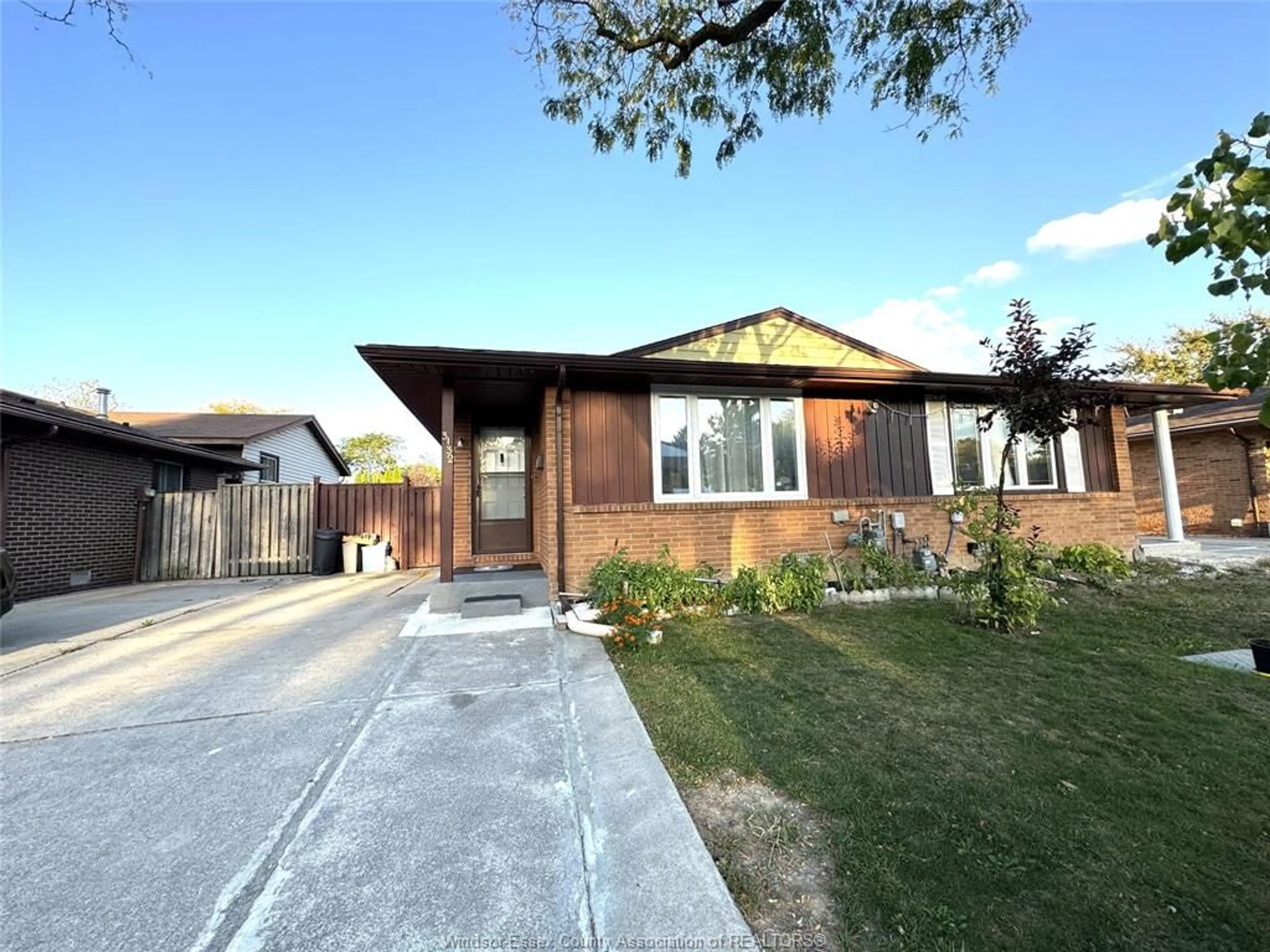 Home with brick exterior material, street for 3132 ELMWOOD Cres, Windsor Ontario N8R 1X4