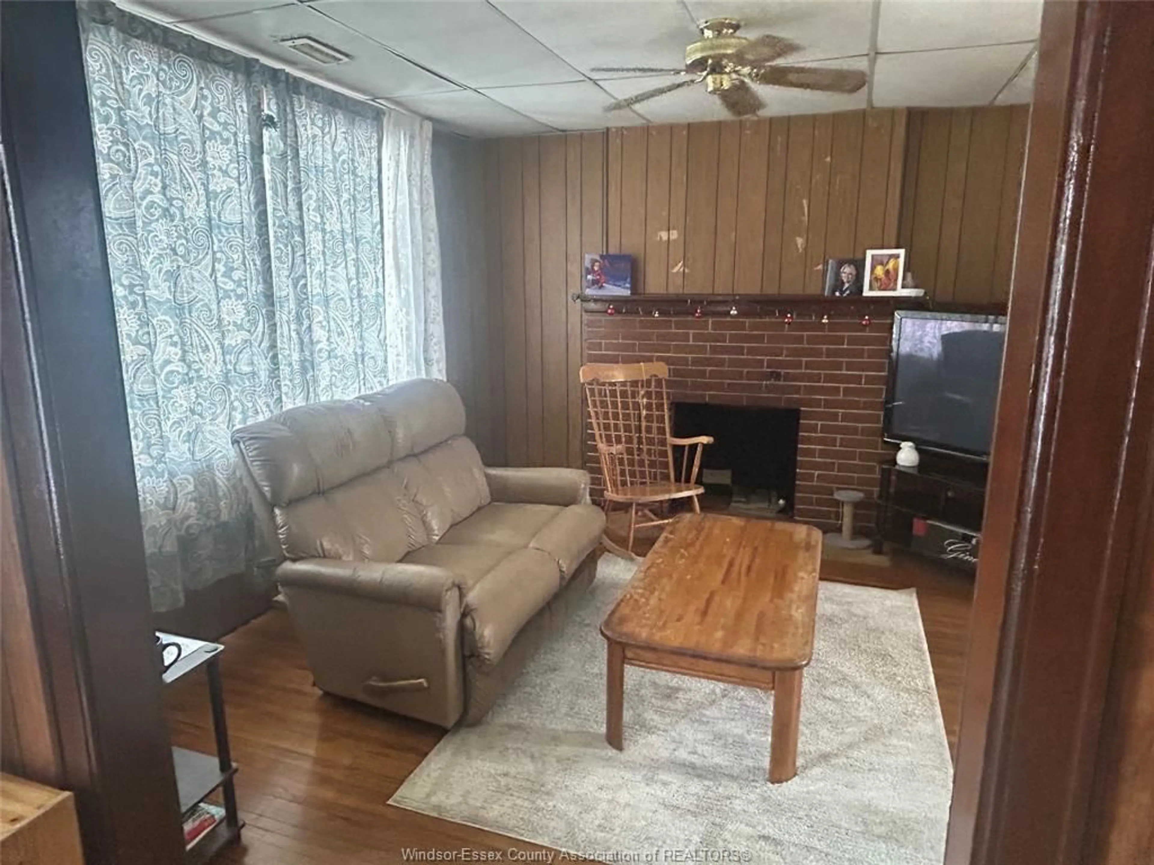 Living room with furniture, wood/laminate floor for 1137 LINCOLN Rd, Windsor Ontario N8Y 2H6