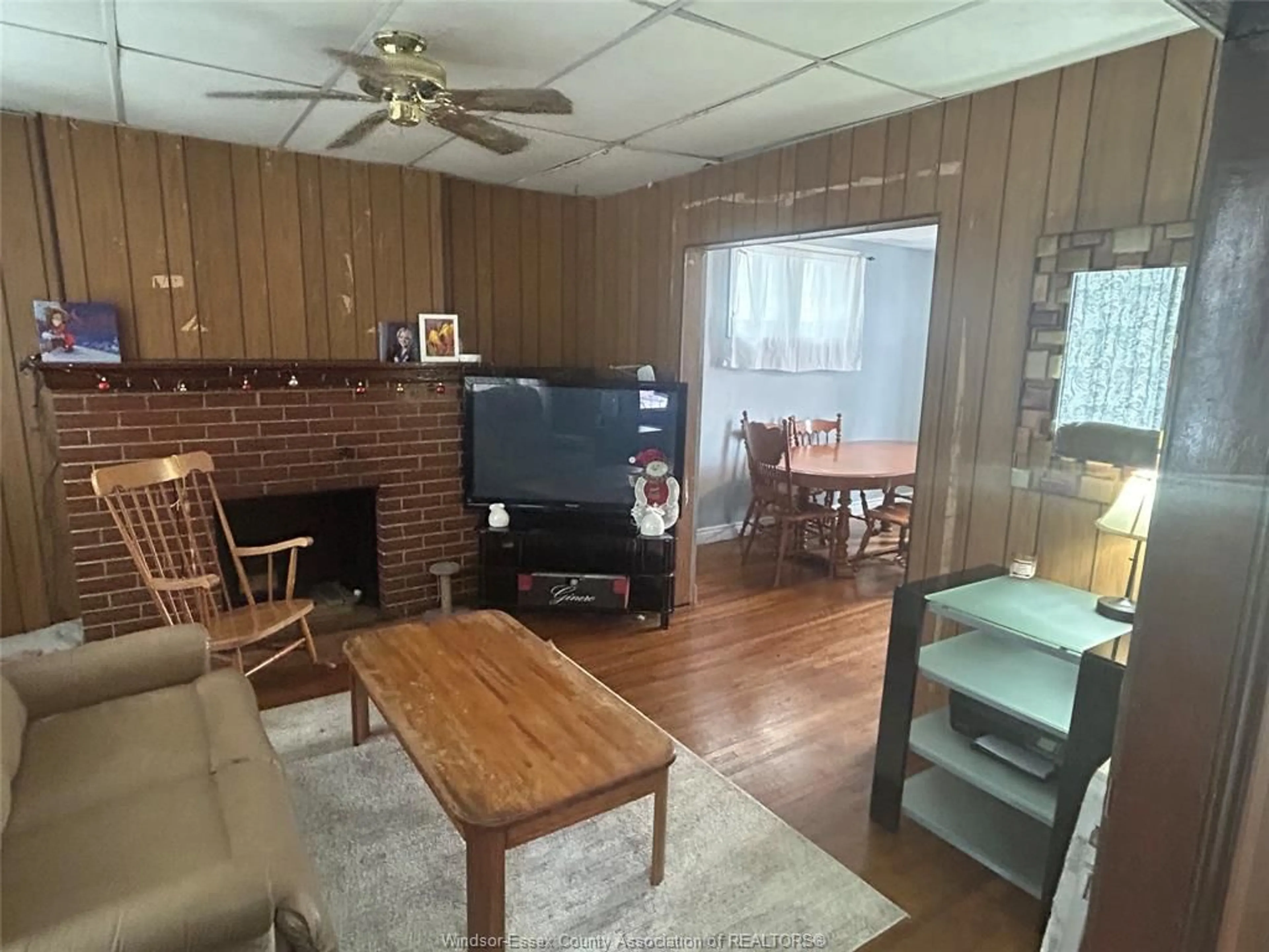 Living room with furniture, wood/laminate floor for 1137 LINCOLN Rd, Windsor Ontario N8Y 2H6