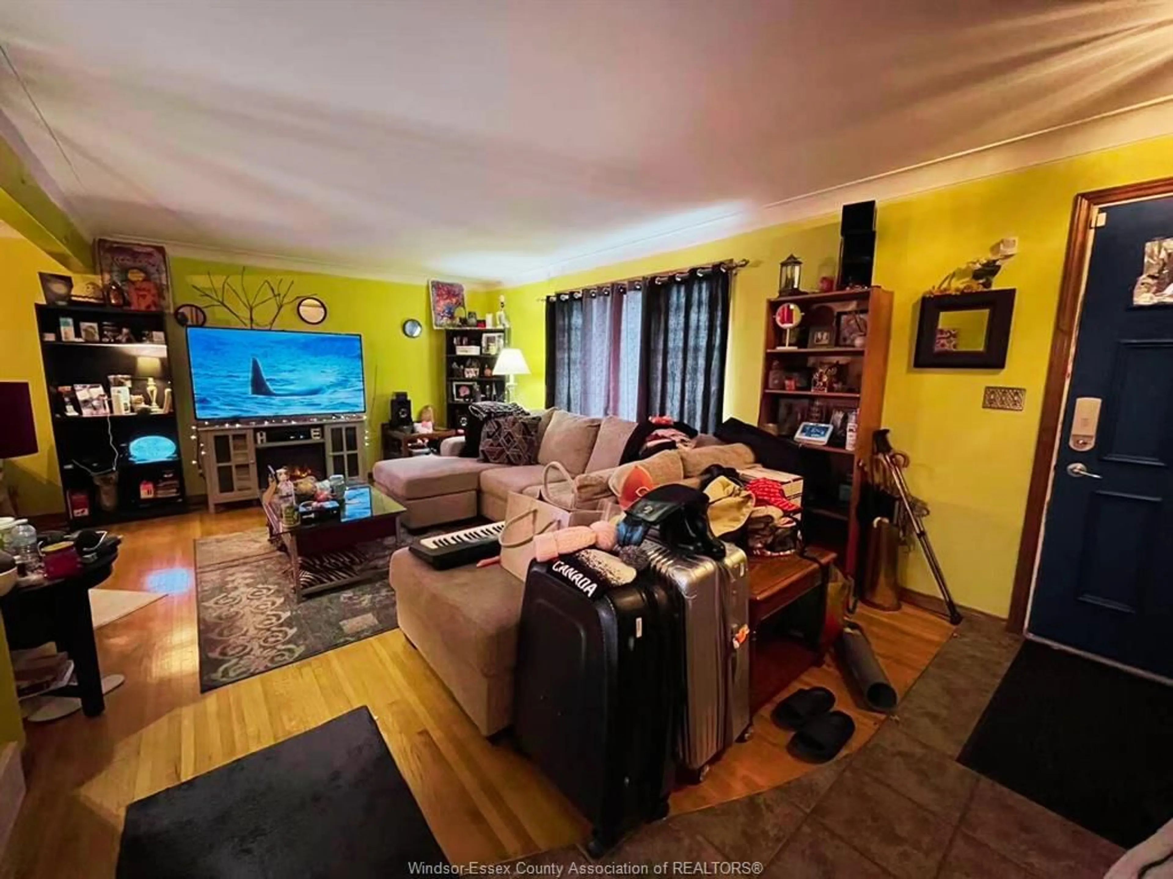 Living room with furniture, wood/laminate floor for 348 WATSON Ave, Windsor Ontario N8S 3S4
