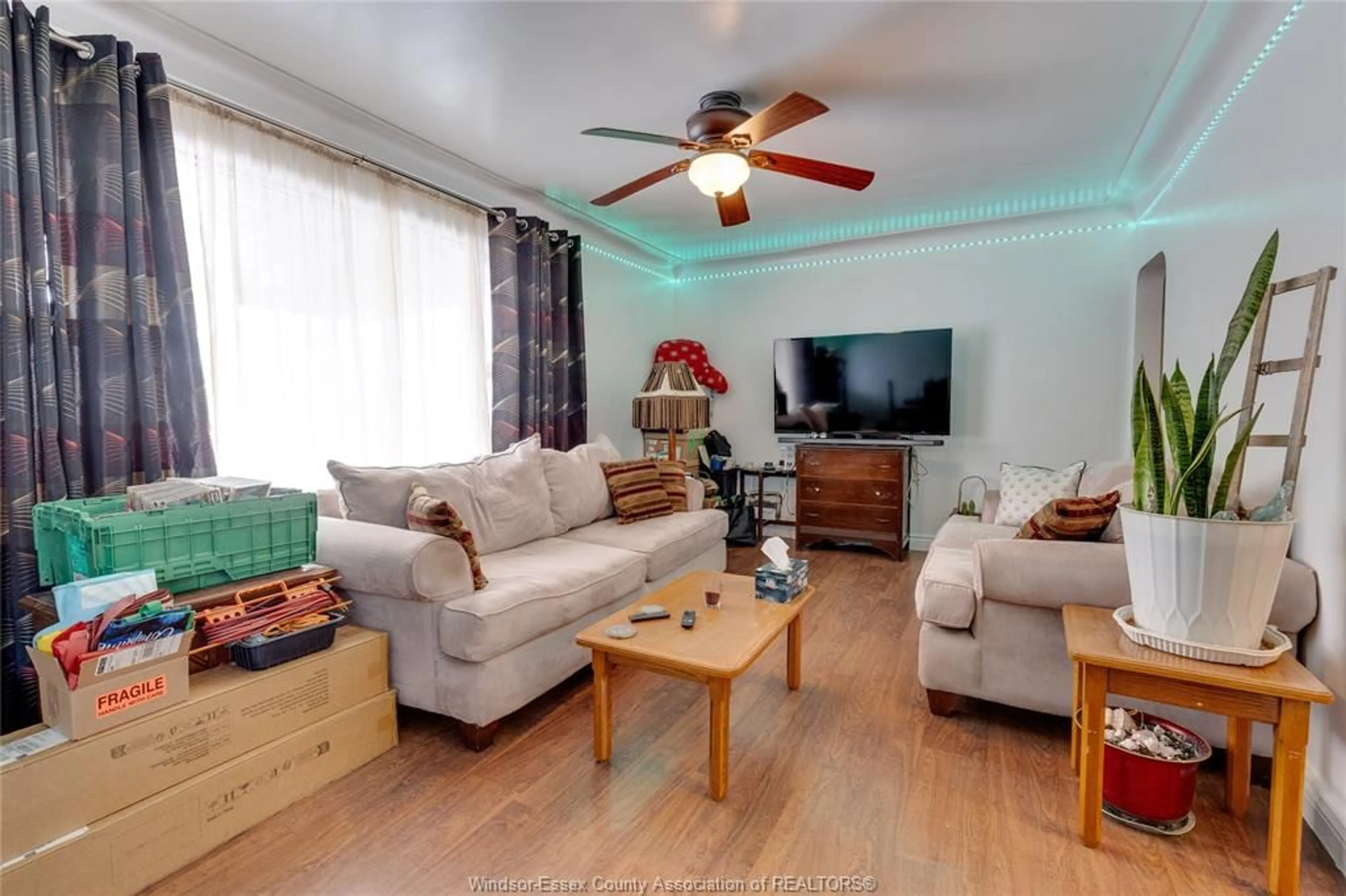 Living room with furniture, wood/laminate floor for 1757 CADILLAC St, Windsor Ontario N8Y 2V7