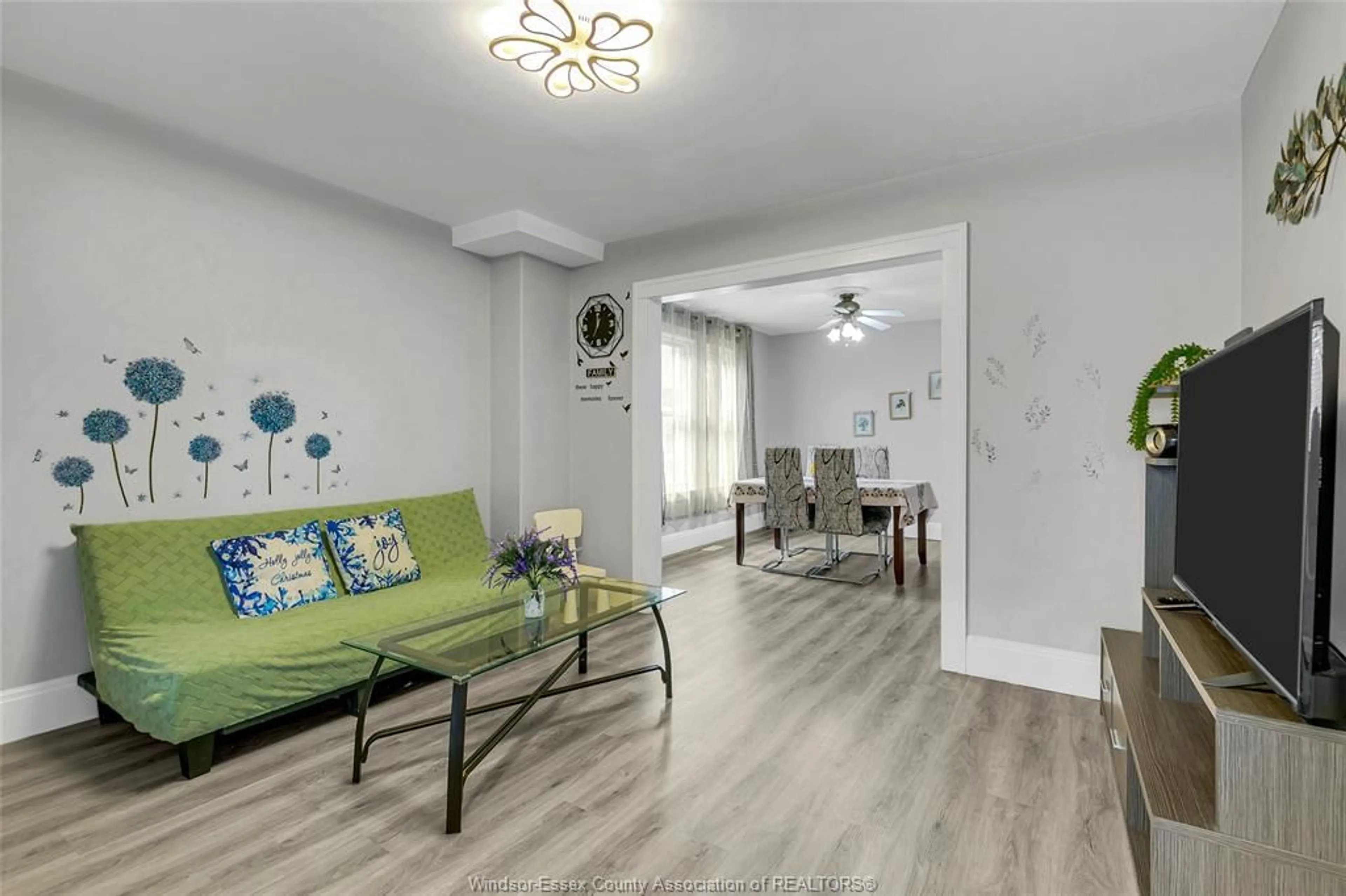 Living room with furniture, wood/laminate floor for 1641 DROUILLARD, Windsor Ontario N8Y 2S4