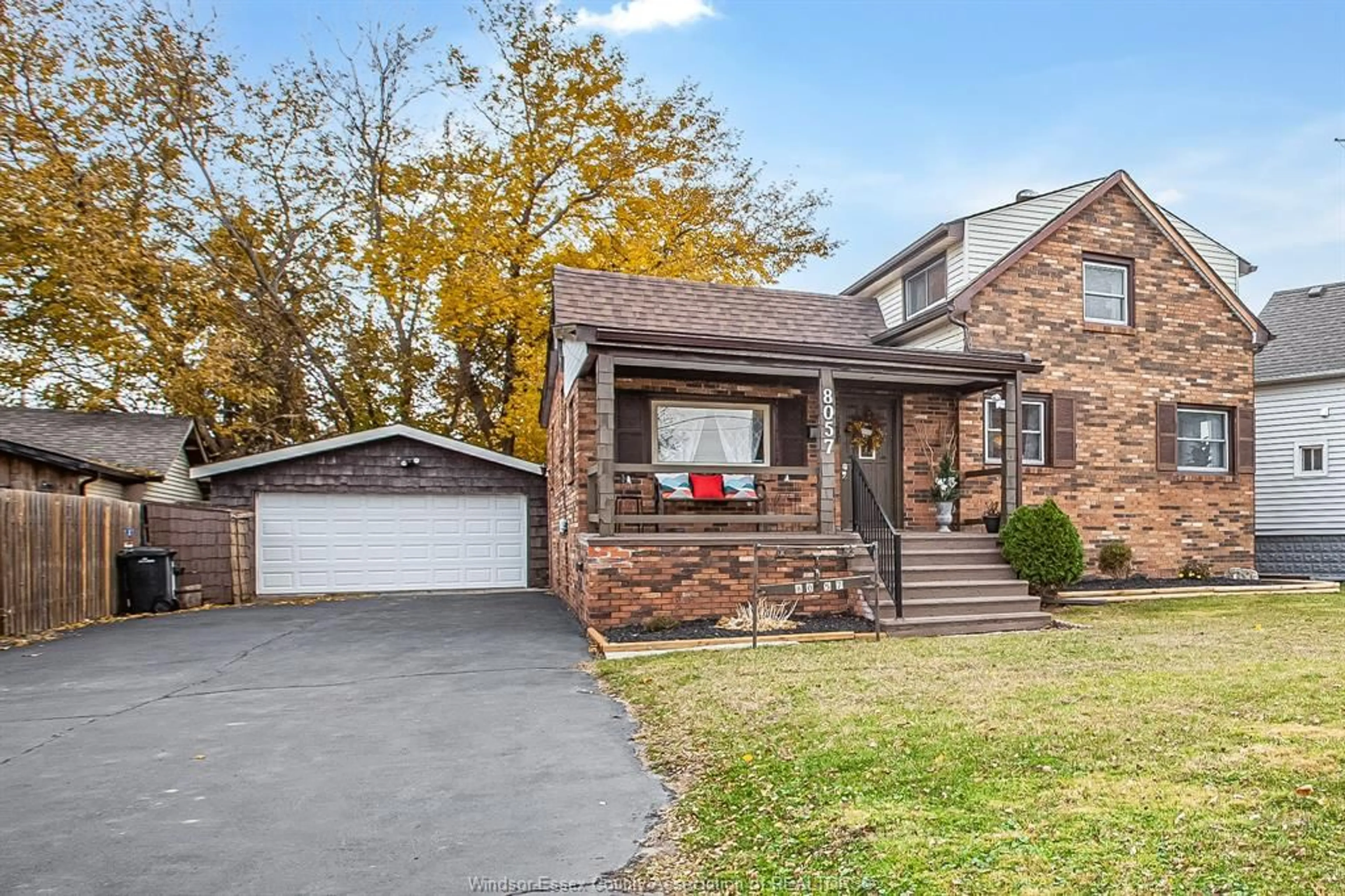 Home with brick exterior material, street for 8057 RIVERSIDE Dr, Windsor Ontario N8S 1E5