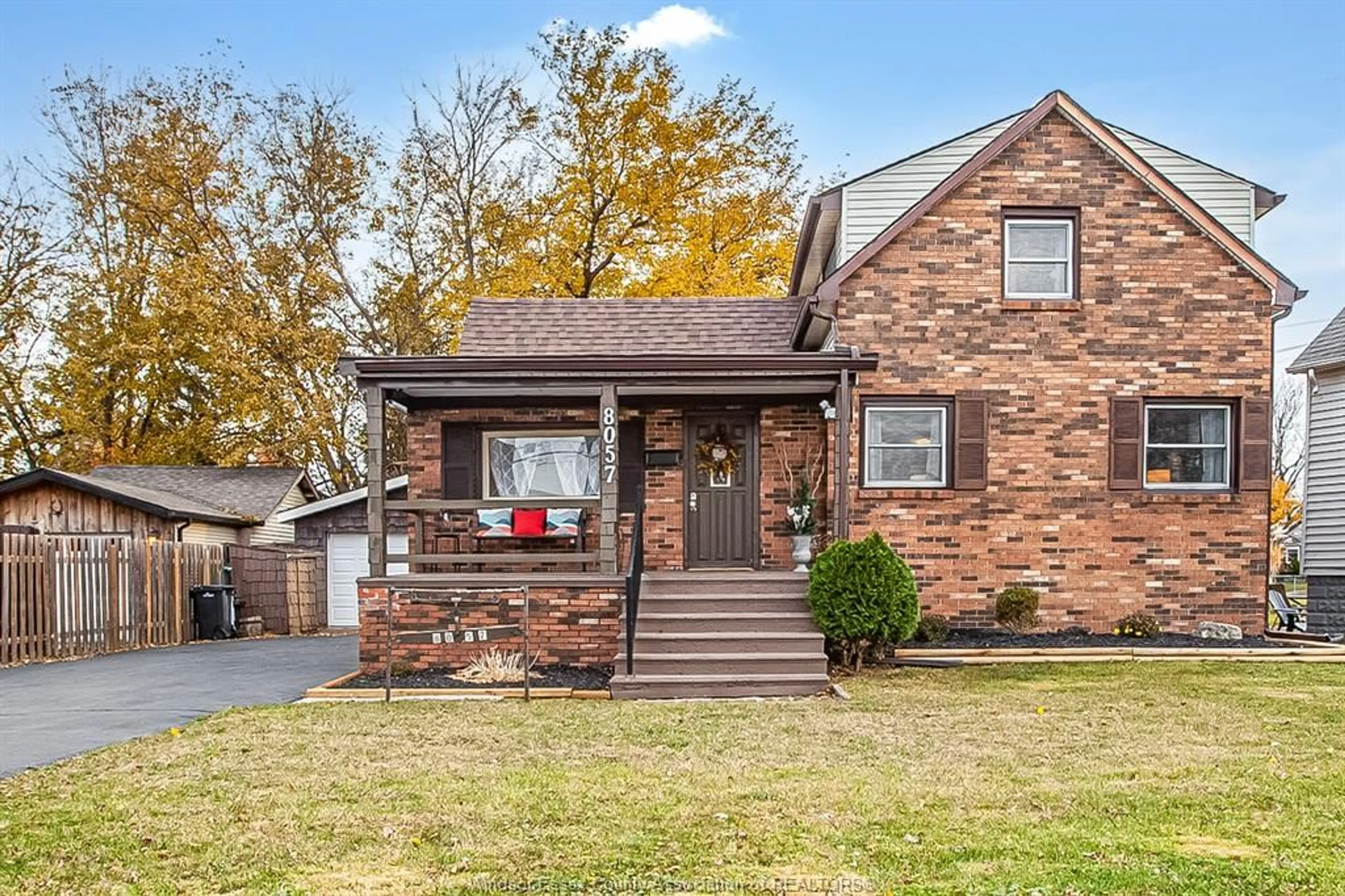 Home with brick exterior material, street for 8057 RIVERSIDE Dr, Windsor Ontario N8S 1E5