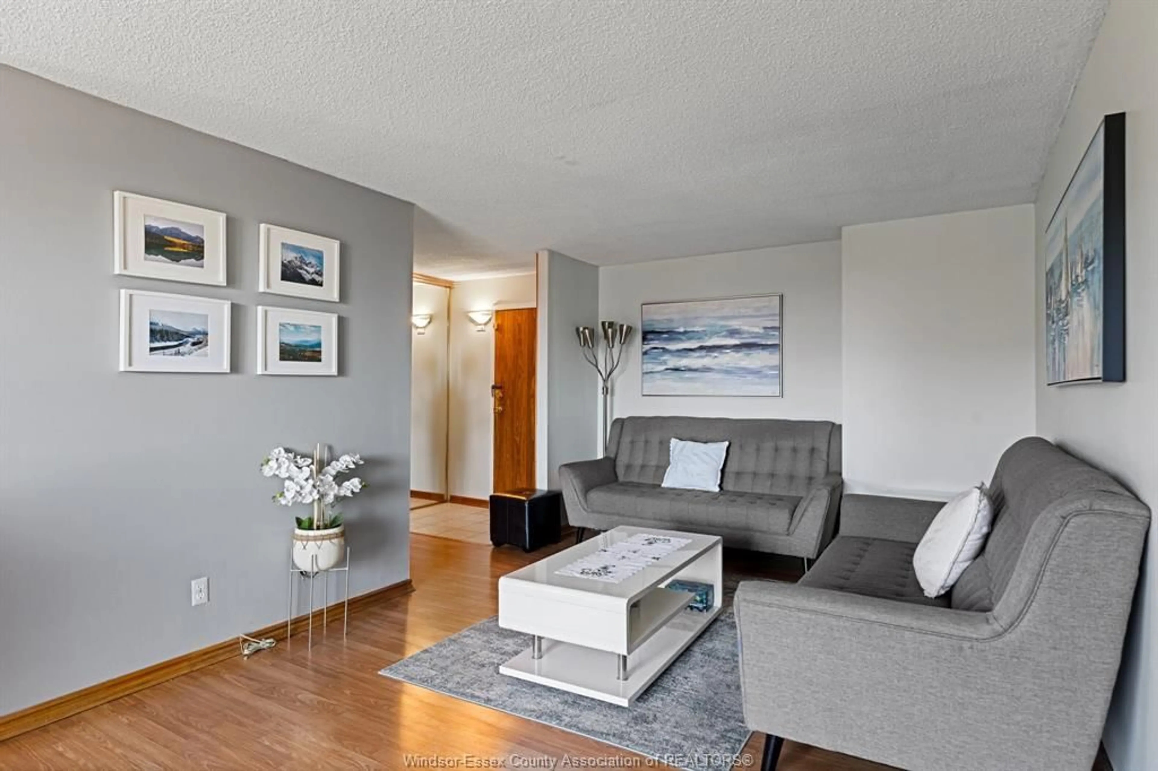 Living room with furniture, wood/laminate floor for 150 PARK St #812, Windsor Ontario N9A 7A2