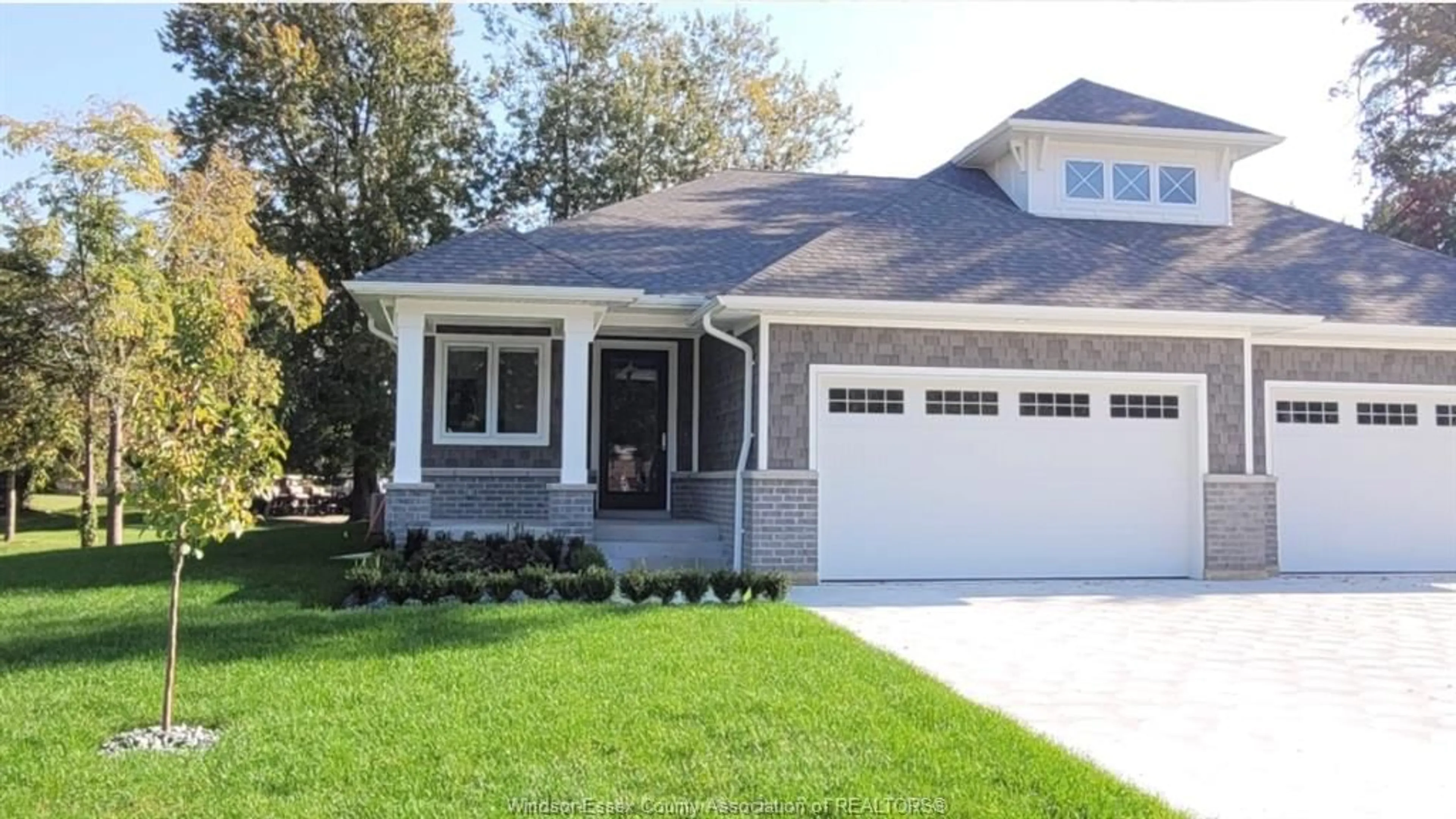 Home with vinyl exterior material, street for 76 BOBLO ISLAND Blvd, Amherstburg Ontario N9V 0H7