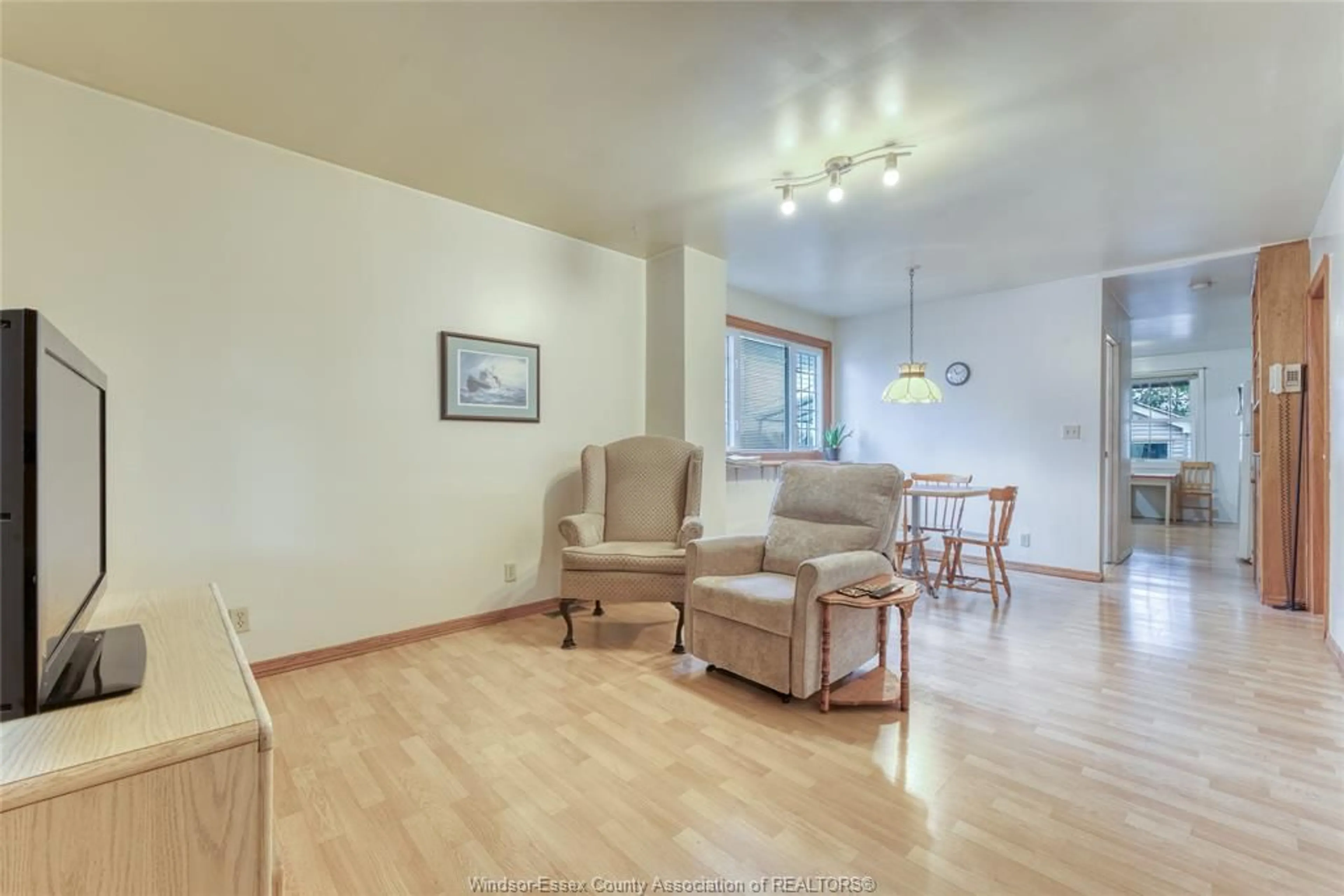 Living room with furniture, wood/laminate floor for 668 SOUTH PACIFIC, Windsor Ontario N8X 2W8