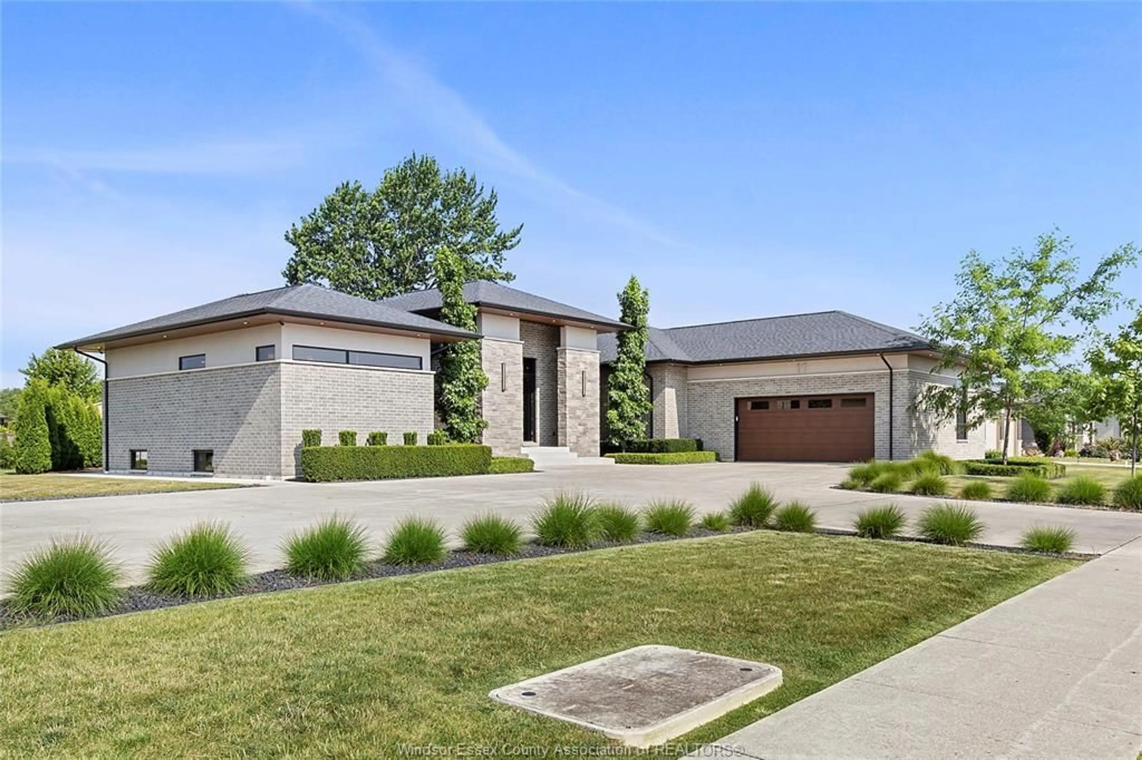 Home with brick exterior material, street for 11 DESTINY Dr, Leamington Ontario N8H 0E1