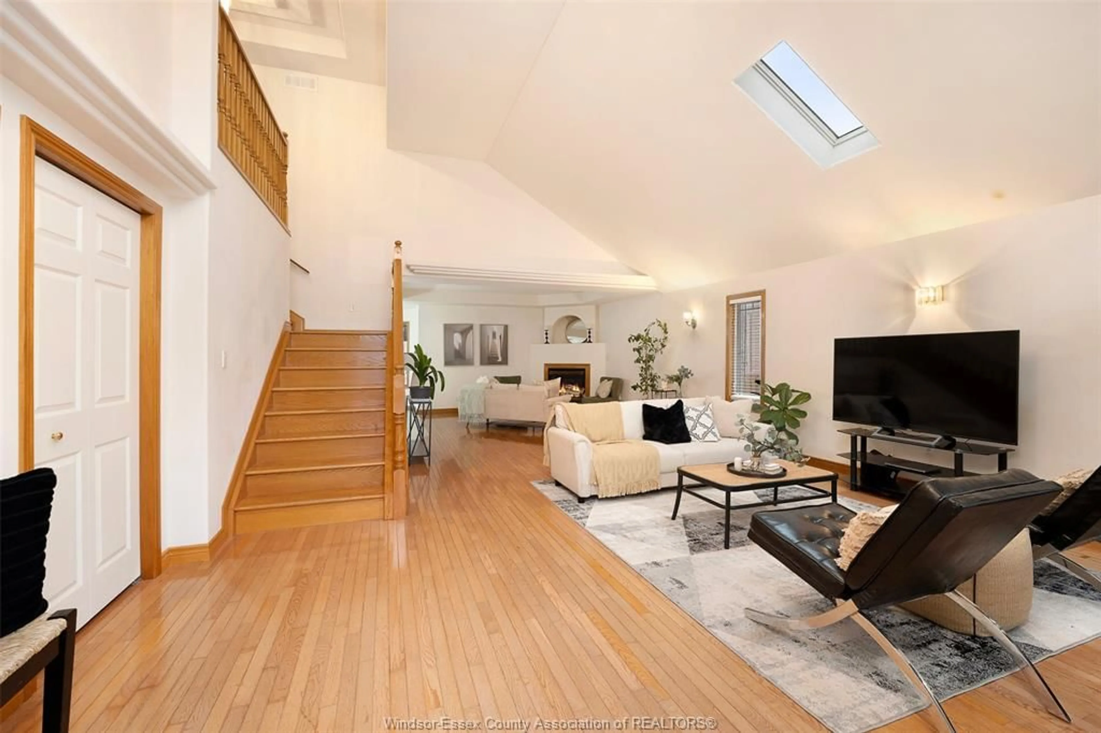 Living room with furniture, wood/laminate floor for 469 John Harvey Crescent, Windsor Ontario N9E 4R3