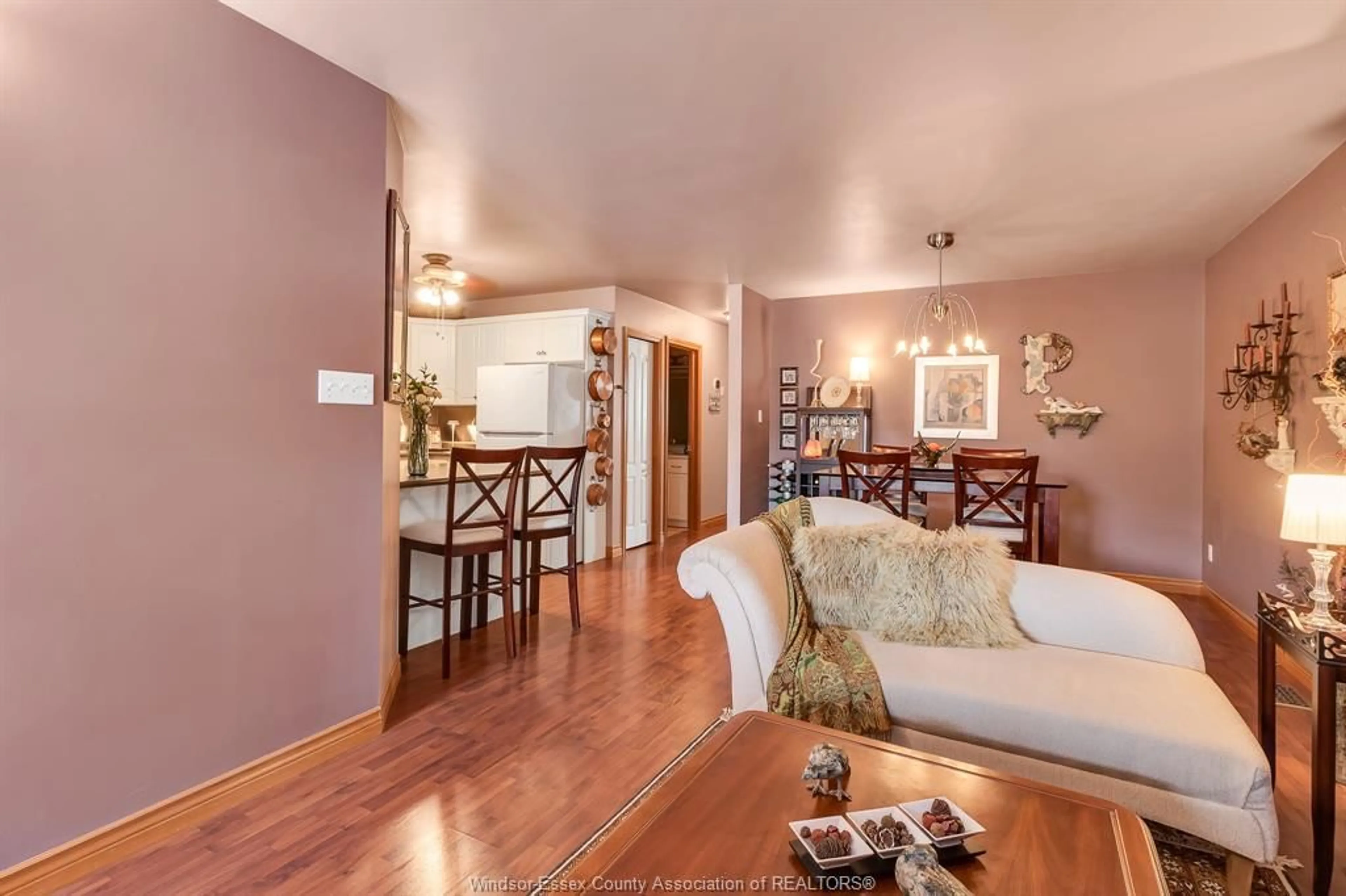 Living room with furniture, wood/laminate floor for 1033 KING RICHARD Crt, Lakeshore Ontario N8L 0V1