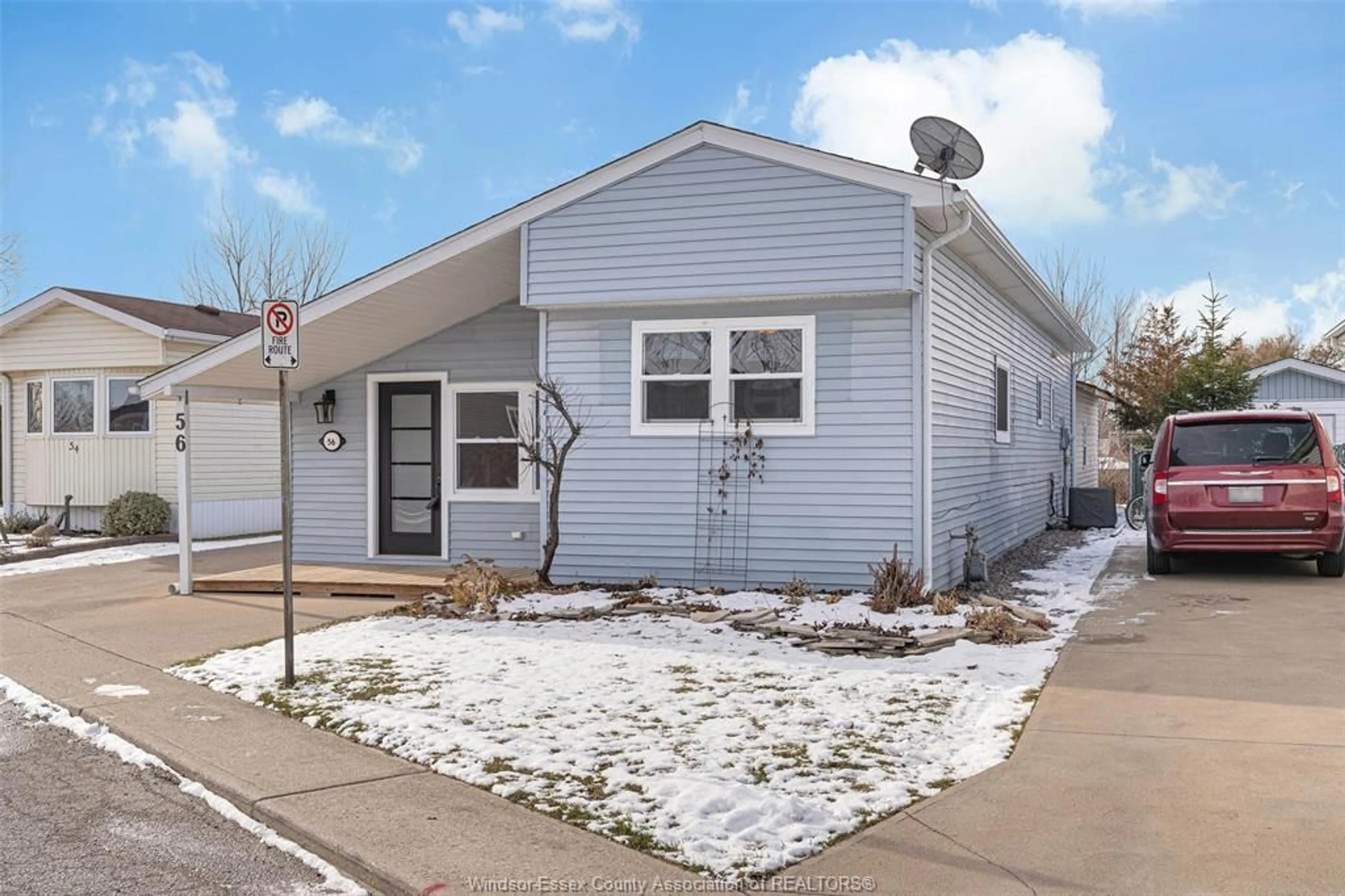 Home with vinyl exterior material, street for 56 PARKSIDE DR, McGregor Ontario N0R 1J0