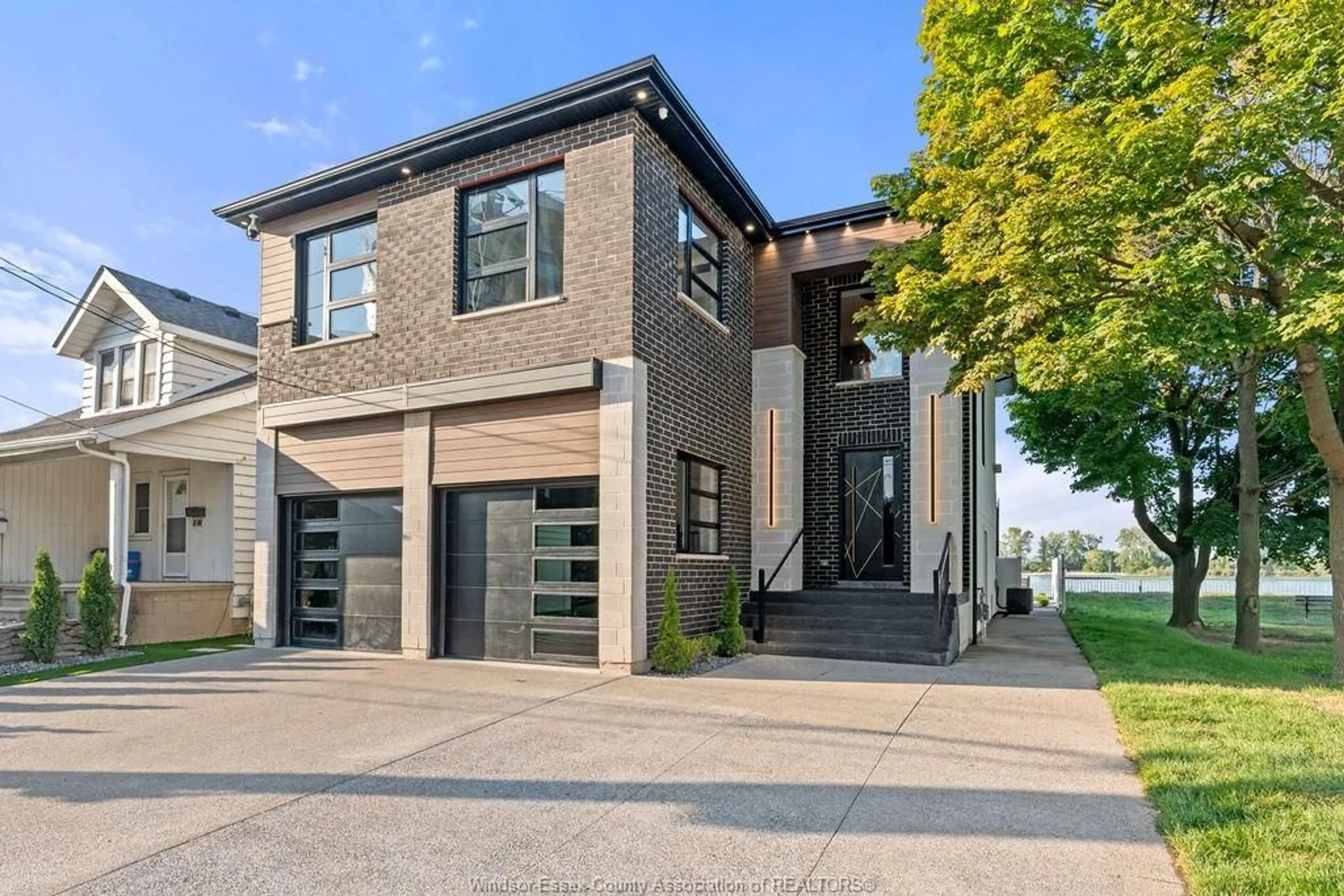 Home with brick exterior material, street for 8720 RIVERSIDE Dr, Windsor Ontario N8S 1E9