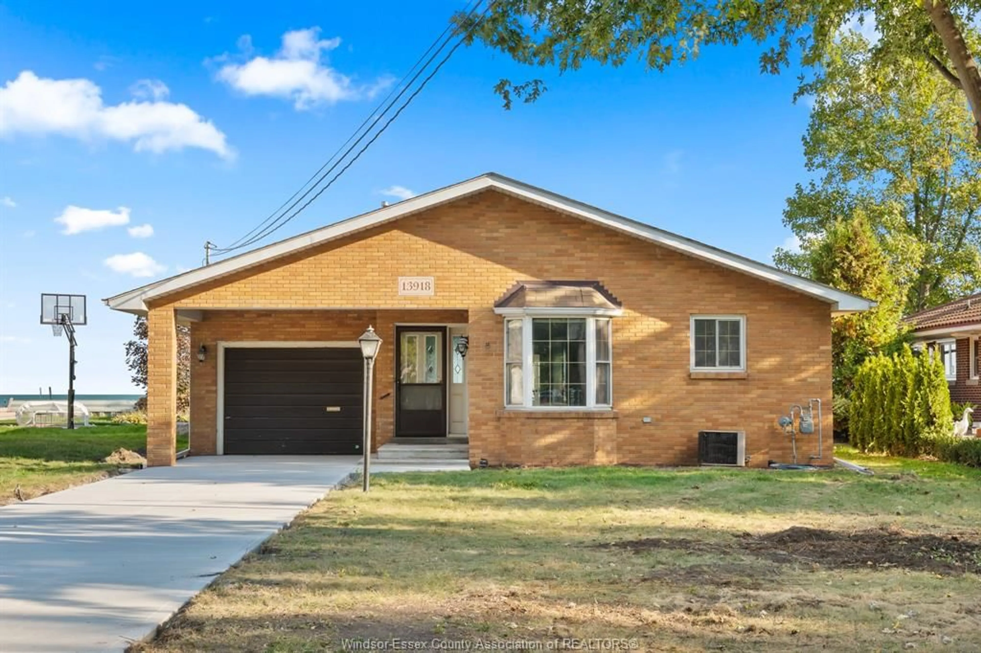 Home with brick exterior material, street for 13918 RIVERSIDE Dr, Tecumseh Ontario N8N 1B6