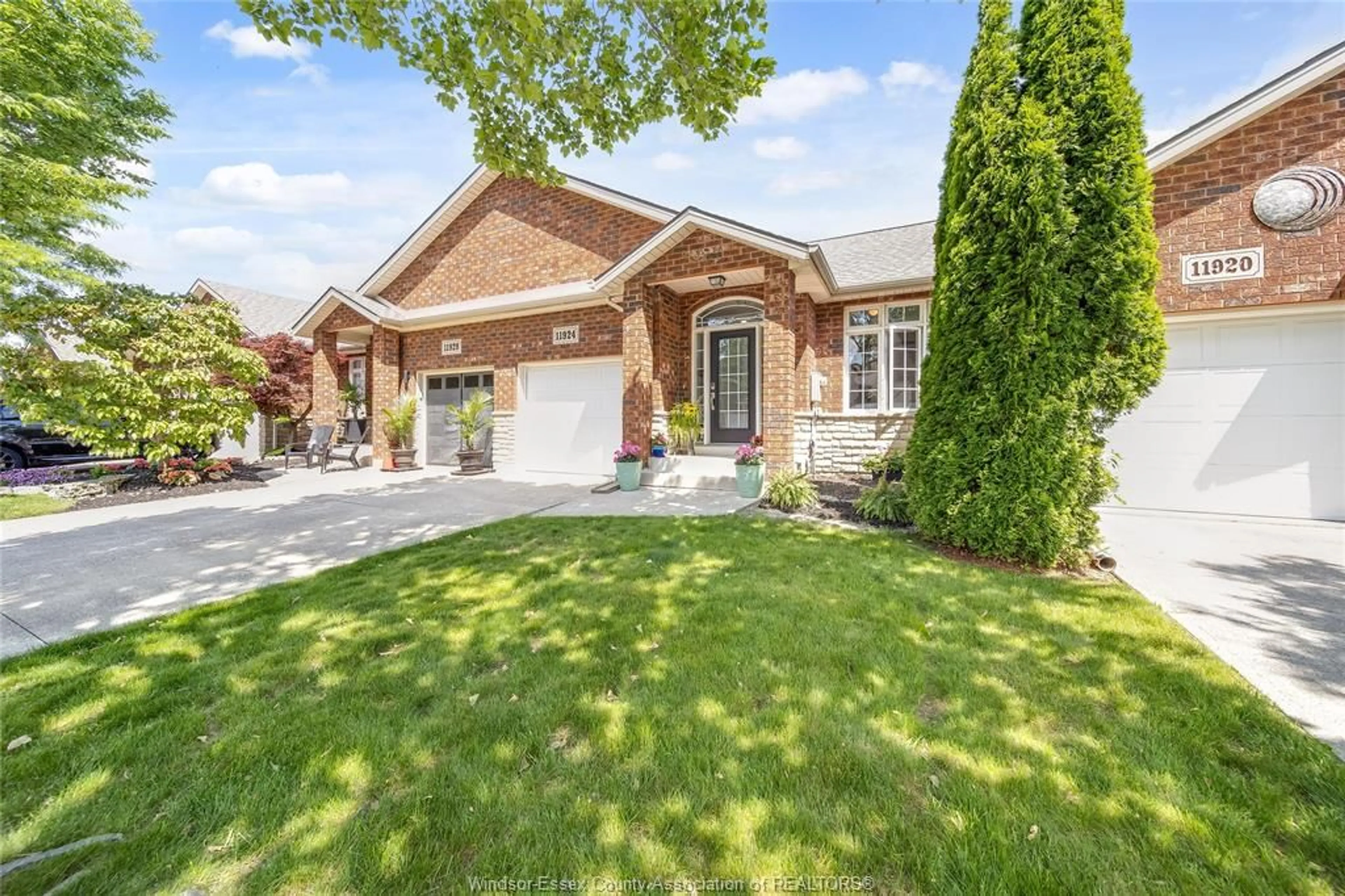 Home with brick exterior material, street for 11924 COBBLESTONE Cres, Windsor Ontario N8P 1T7