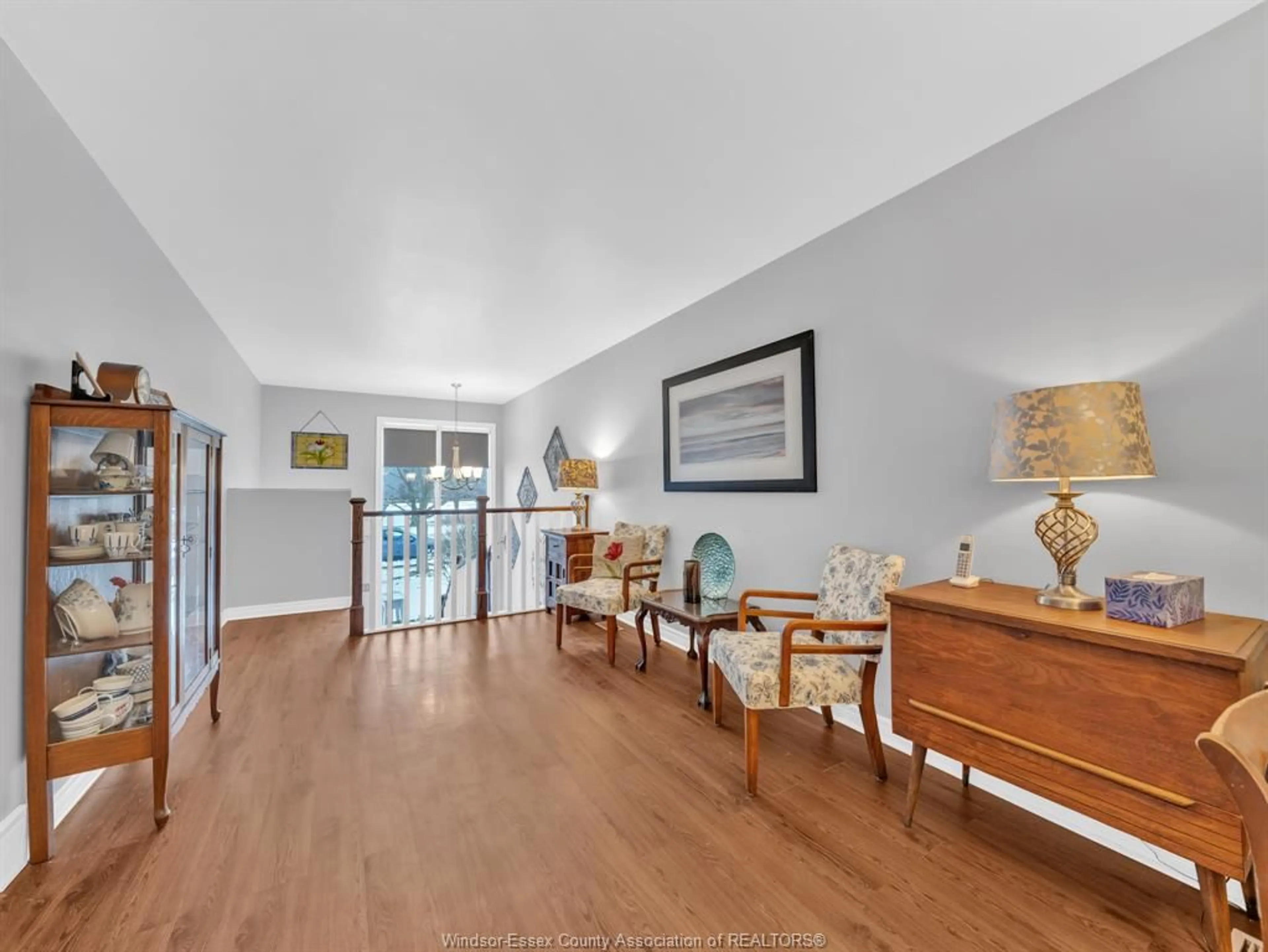 Living room with furniture, wood/laminate floor for 3755 HOLBURN, Windsor Ontario N9E 4S9