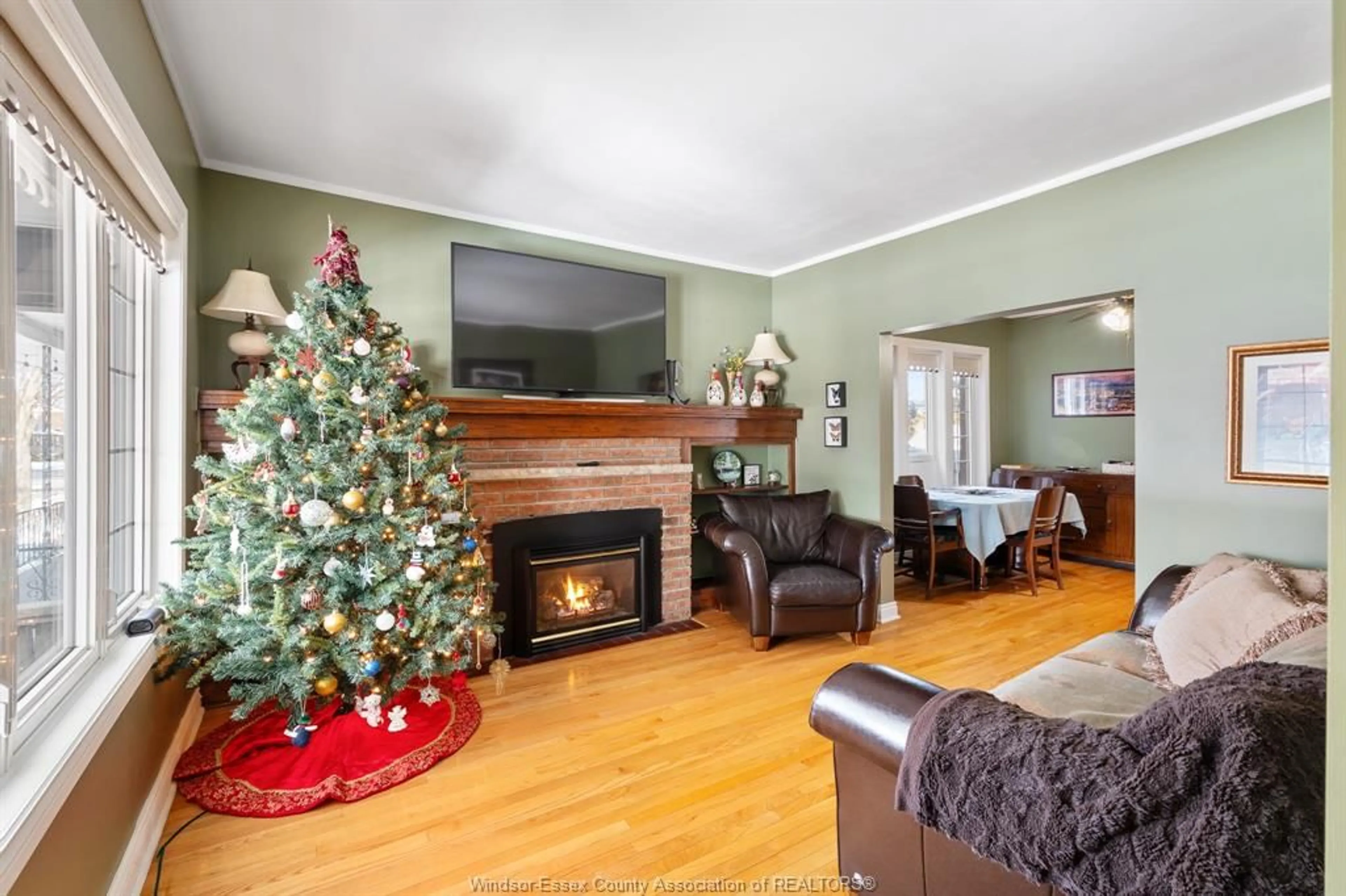 Living room with furniture, wood/laminate floor for 1566 HALL Ave, Windsor Ontario N8X 4R7