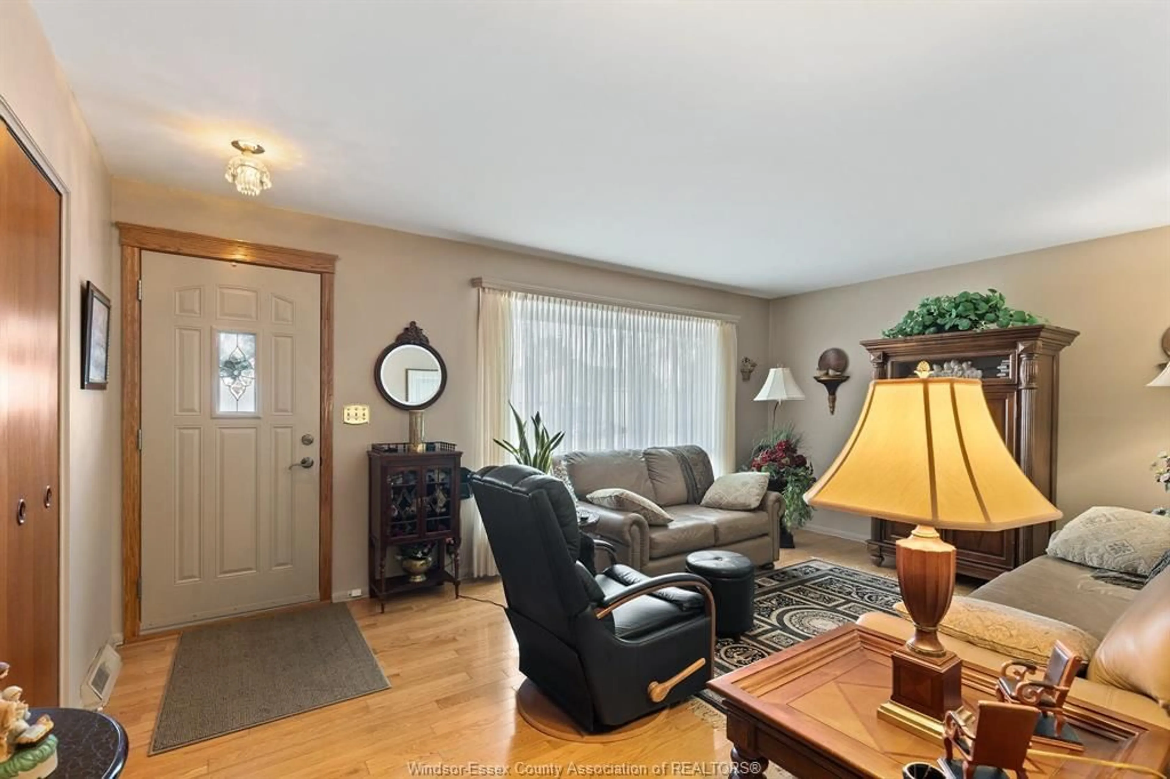 Living room with furniture, wood/laminate floor for 1615 Leduc, Windsor Ontario N9B 1S9